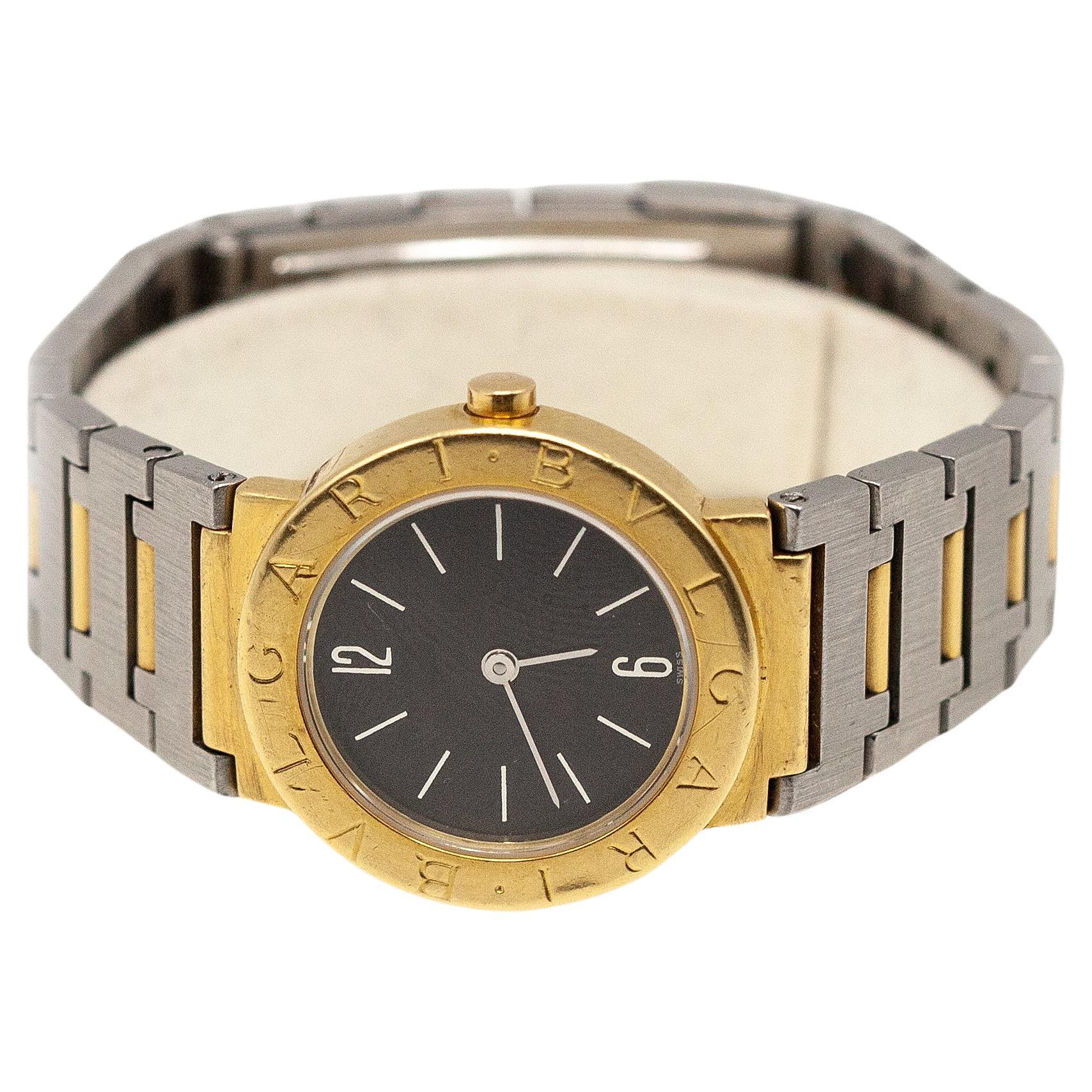 Bulgari Diagono Stainless Steel ladies wrist watch with a classic BVLGARI bezel & case in 18K yellow gold. Steel hands & markers over black dial, steel folding clasp

Approximate Gross Weight: 61.80 grams

Approximate Measurement:
Case - 25mm
Fits a