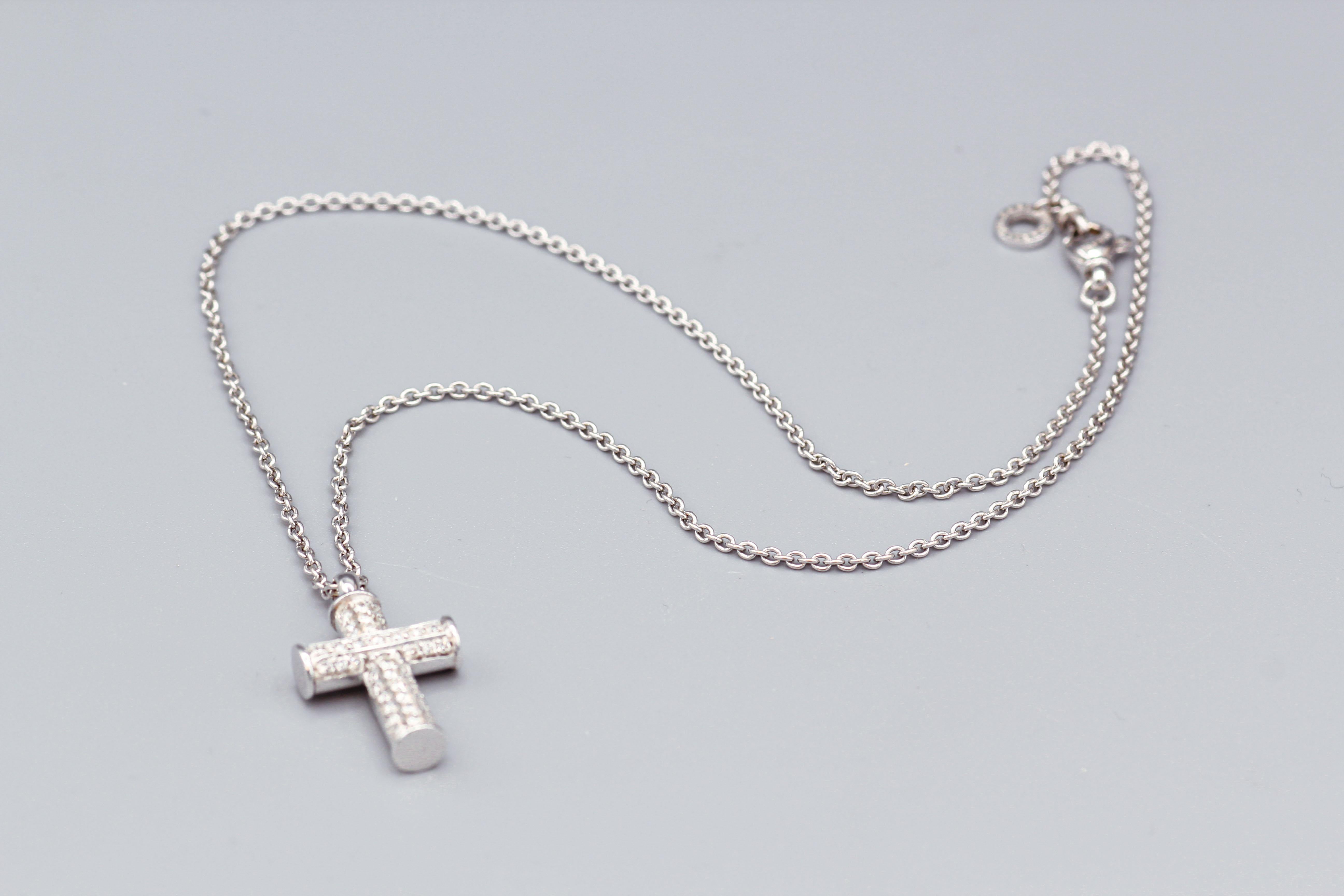 For your consideration, a fine Bulgari diamond and 18 Karat white gold cross pendant necklace, a beautiful piece of fine jewelry that features many design elements.  The necklace is made of high-quality 18 karat white gold, which is a precious and
