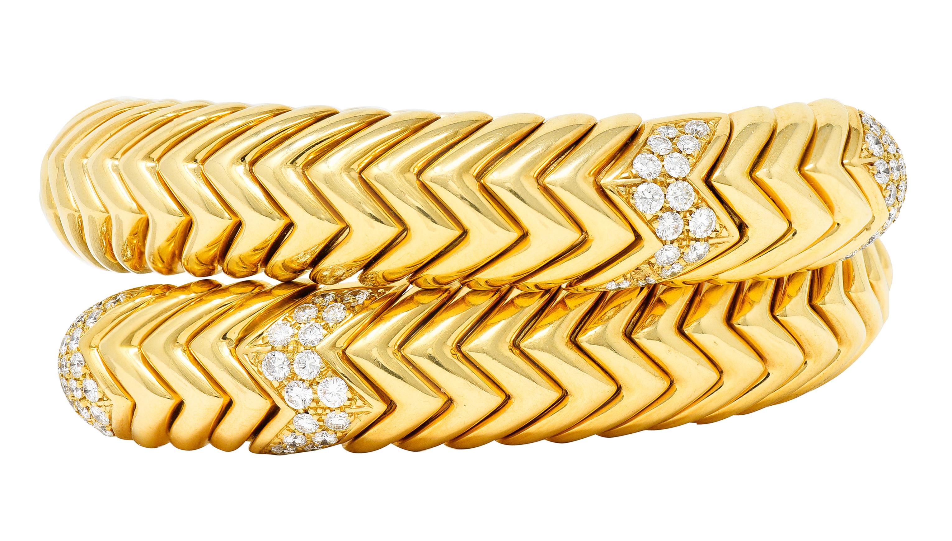 Flexible cuff bracelet wrap is comprised of polished gold chevron links

Deeply ridged and pavè set with round brilliant cut diamonds

Weighing in total approximately 1.90 carats - F/G color with VS clarity

Italian assay marks for 18 karat gold and