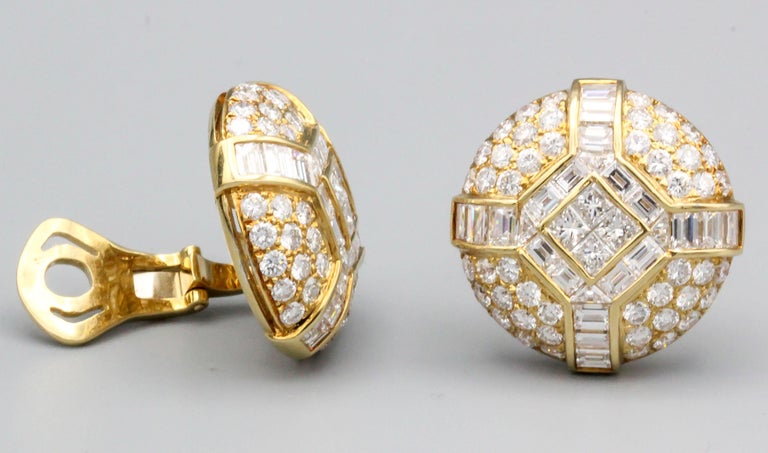 Fine pair of diamond and 18k yellow gold dome earrings by Bulgari, circa 1970-80s.  They features round, baguette, and princess cut diamonds for approx. 10-12 carats total weight.  

Hallmarks: Bvlgari, 18k, 750, Italian workshop identifier.