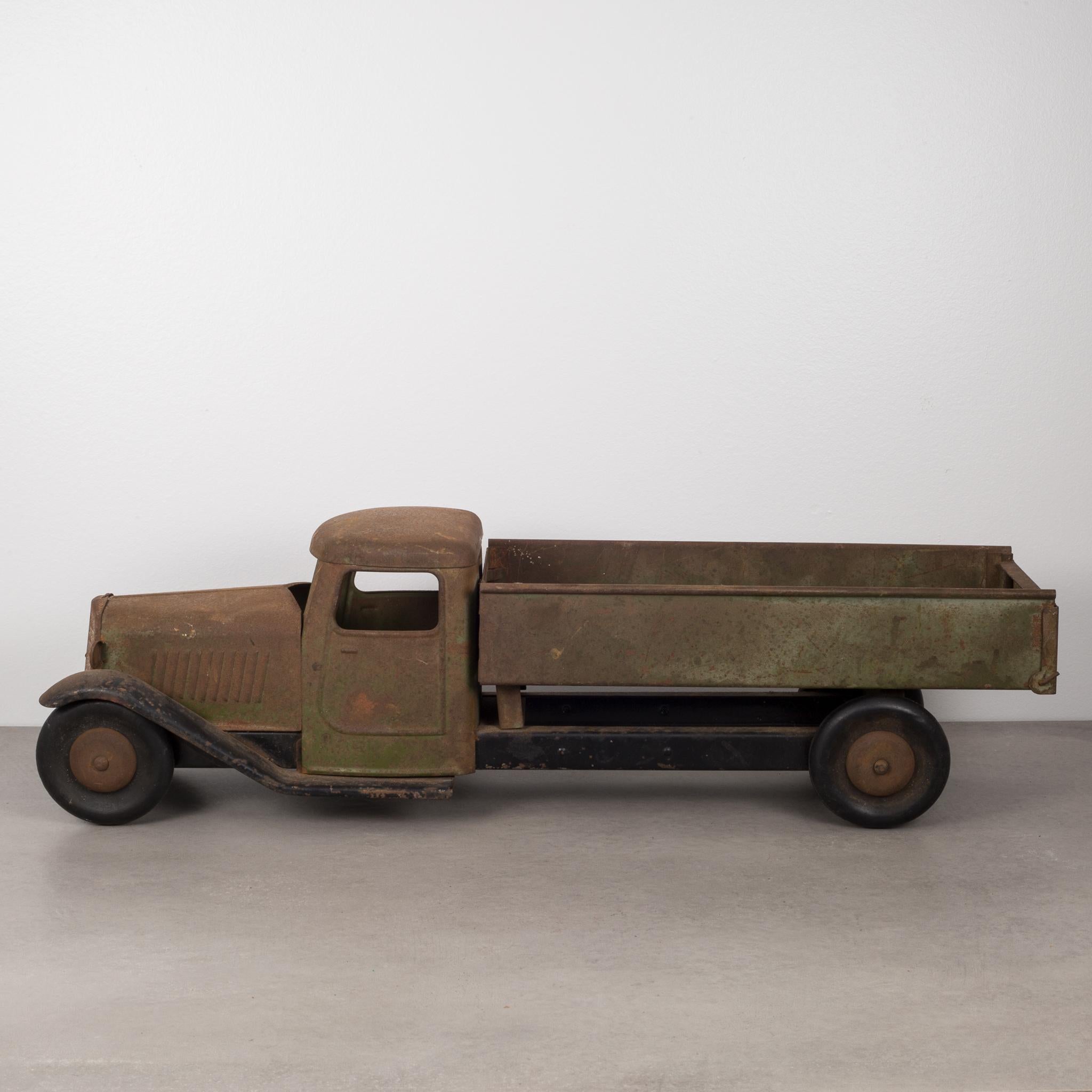 ABOUT

This is an original die cast steel toy truck with rubber wheels by Sctructo Manufacturing. The truck has Sctructo label on the tailgate.  The piece has appropriate patina for its age. The rubber wheels and toy mechanism are in excellent