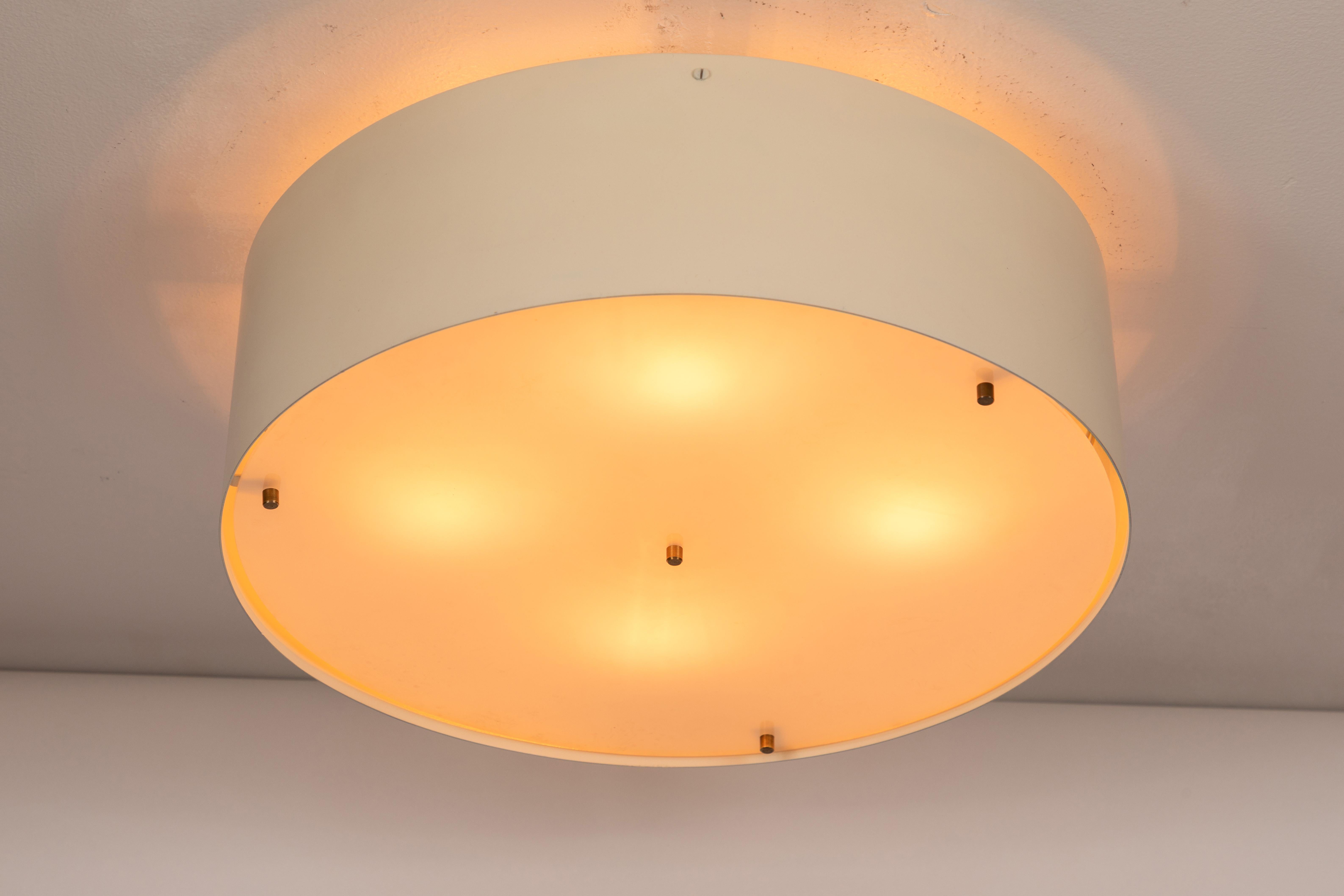 1950s Jacques Biny ceiling light for Luminalite. Executed in painted aluminum with opaque diffuser and brass decorative screws for Luminalite, France.

Professionally rewired for US electrical. Accommodates 4x 25W max US candelabra bulbs (higher