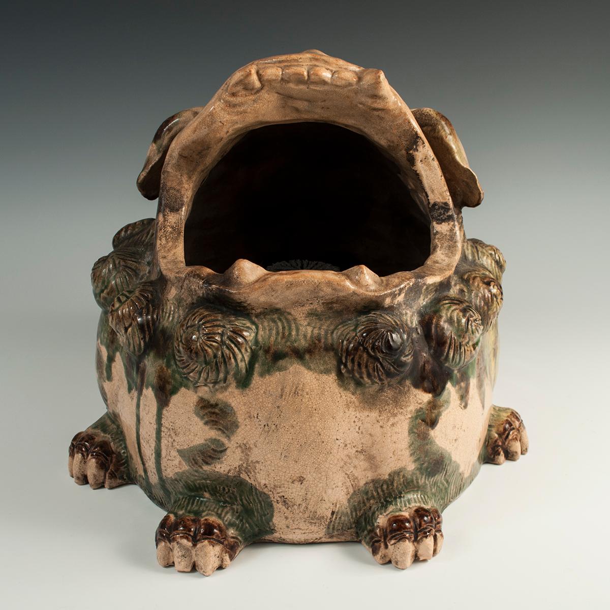 19th century Ceramic Shishi Lion Hand Warmer, Japan

This ceramic hand warmer is in the form of a shishi lion, a beast with magical properties, including the power to repel evil. It is heavy and has very thick walls; there are a couple of