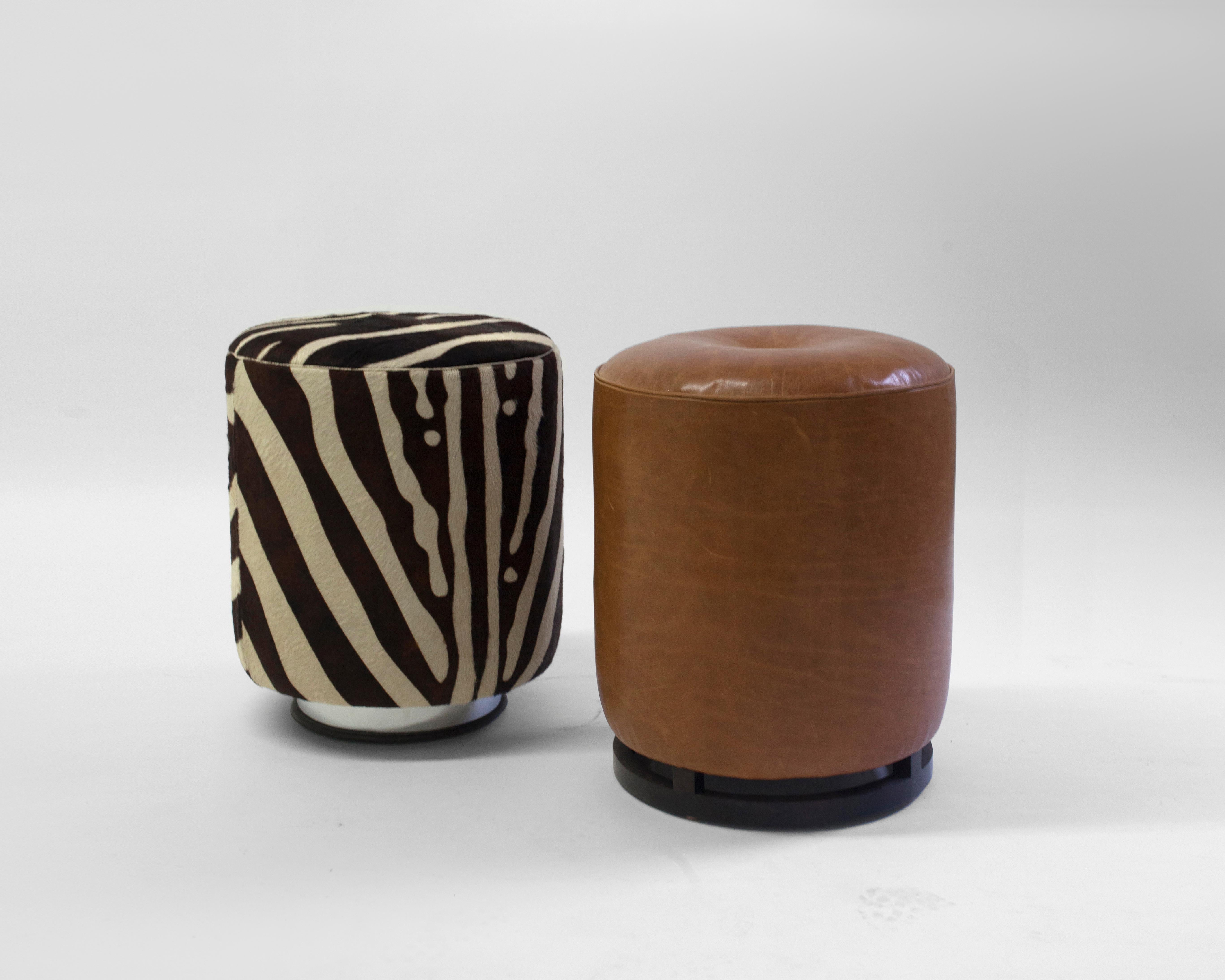 The Colle Pouf is 1 of two poufs we offer in our LF Collection - it is shown in brown leather and faux skin but can covered in customers own material - this versatile accent piece can be used as both seating and as a pull up table - the dark wood