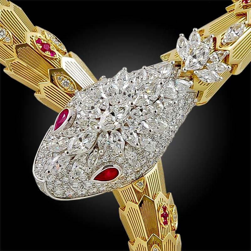 Capturing the seductive and alluring quintessence of the Bulgari Serpent, this resplendent piece sinuously curves around the neck, with scales comprised of 18k yellow and white gold, accented with several diamonds and rubies, a pavé head filled with