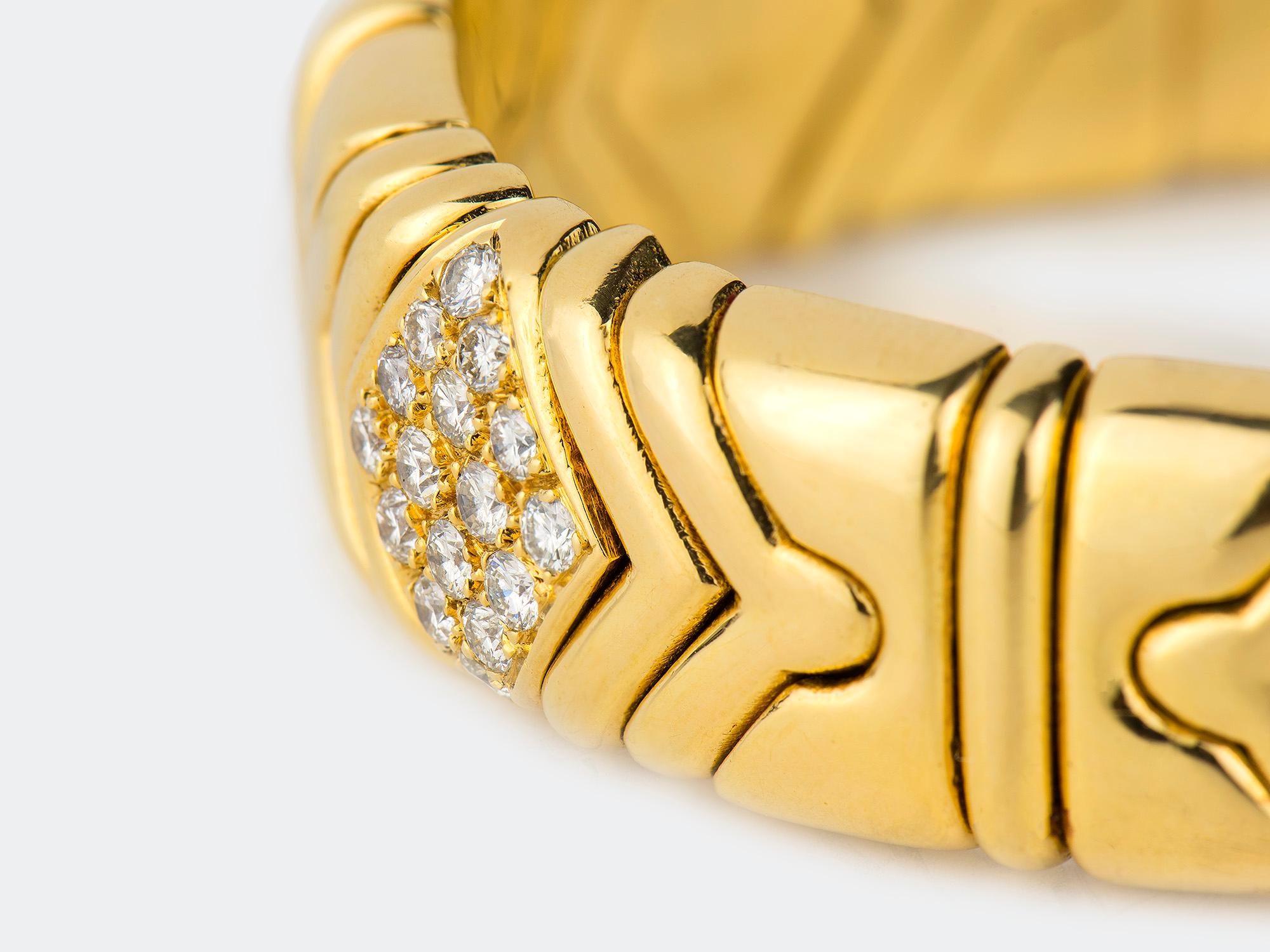 18K gold and diamond bangle bracelet. Diamond weight is approximately 3.50 carats. Signed BULGARI 750.
