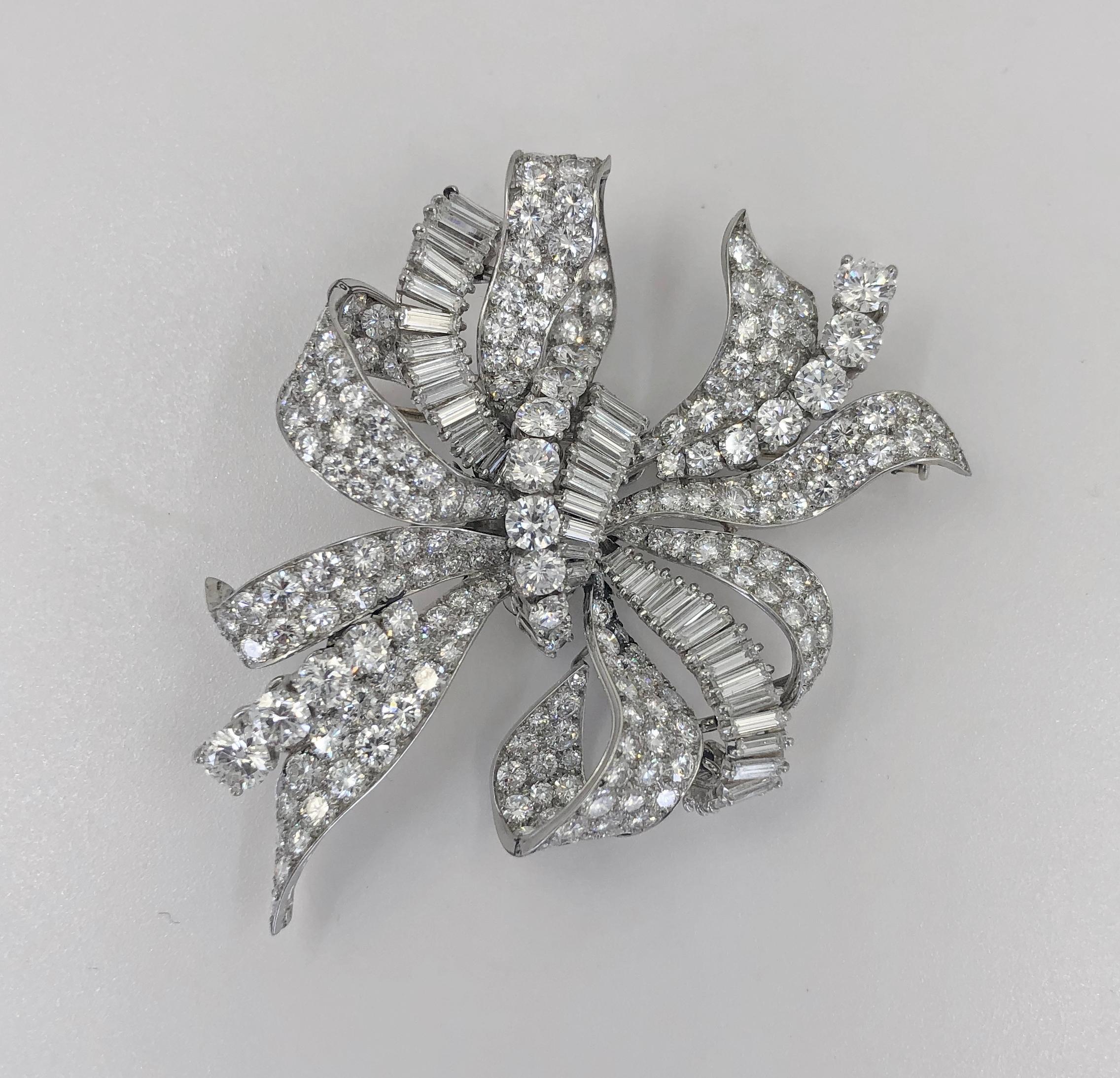 BULGARI Diamond Bow Brooch.

A platinum bow, set with round and baguette diamonds weighing approx. 22-24 carats DEF color, VVS clarity.
Gross weight approx. 40 grams and dimensions approx. 2.5″ x 2.0″
Stamped “Bulgari“; Italy; circa 1950s