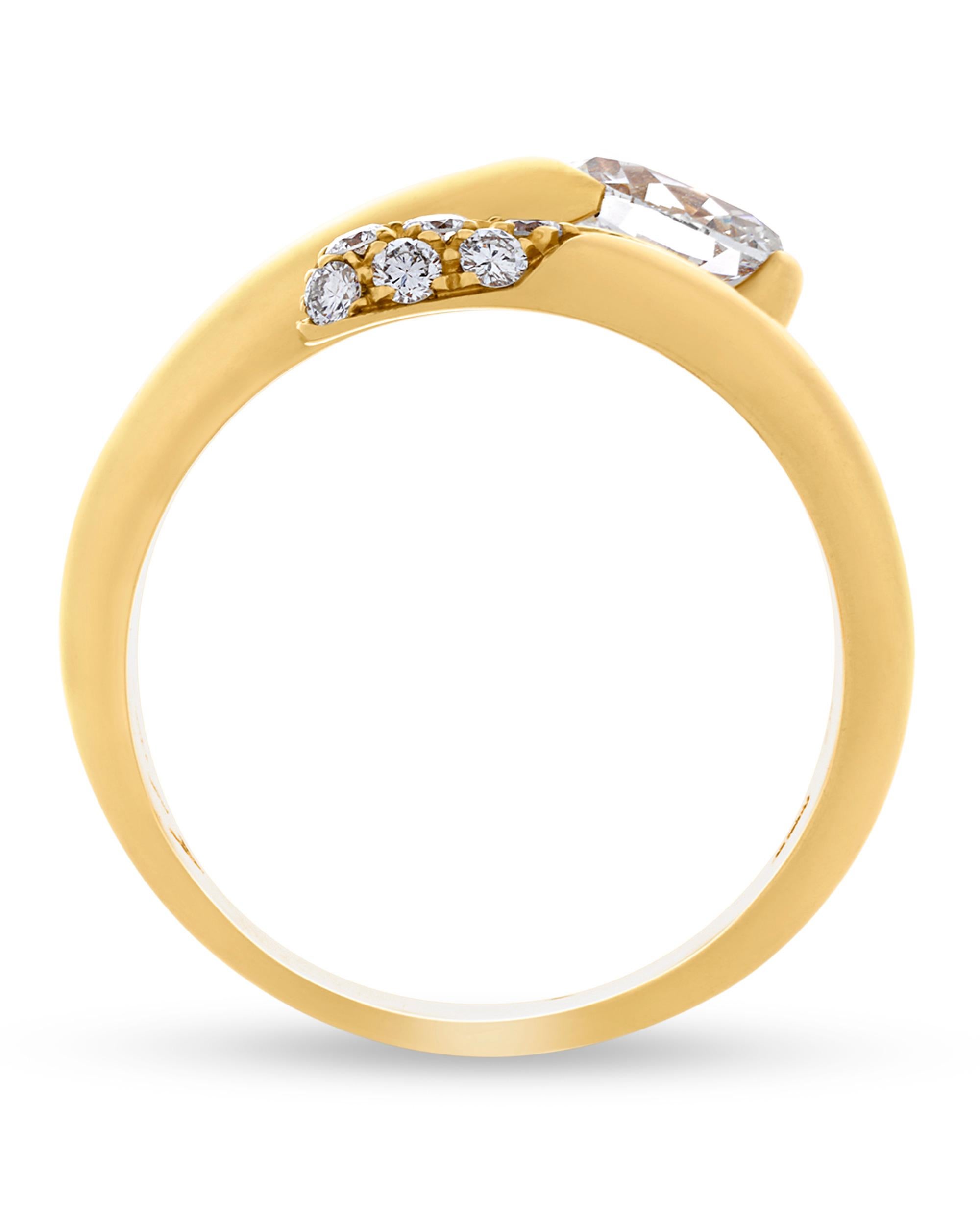 Designed by Bulgari, this exceptional bypass ring is crafted of 18K yellow gold. The sleek ring features approximately 0.68 carat of white diamonds and reflects the striking design qualities for which the Italian firm is known.

Stamped “BVLGARI”