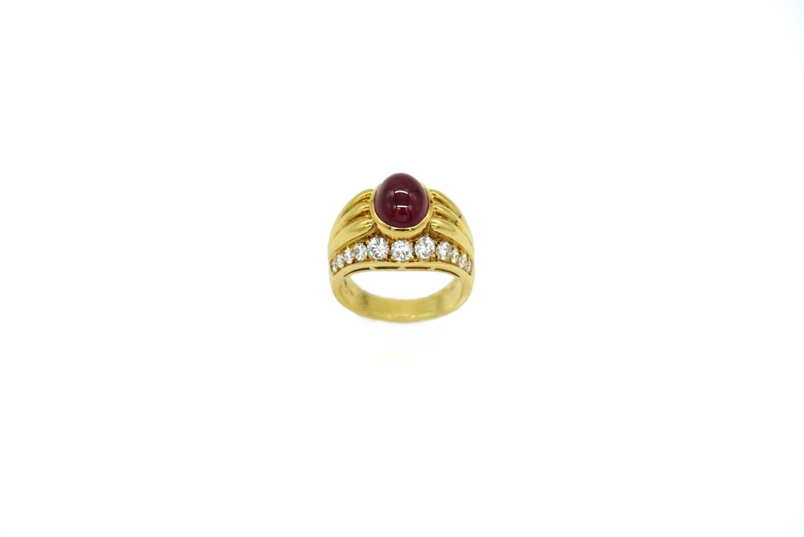 Bulgari 18 karat yellow gold ring with a 4.05 carat cabochon ruby and round brilliant diamonds. Made in Italy, circa 1980.