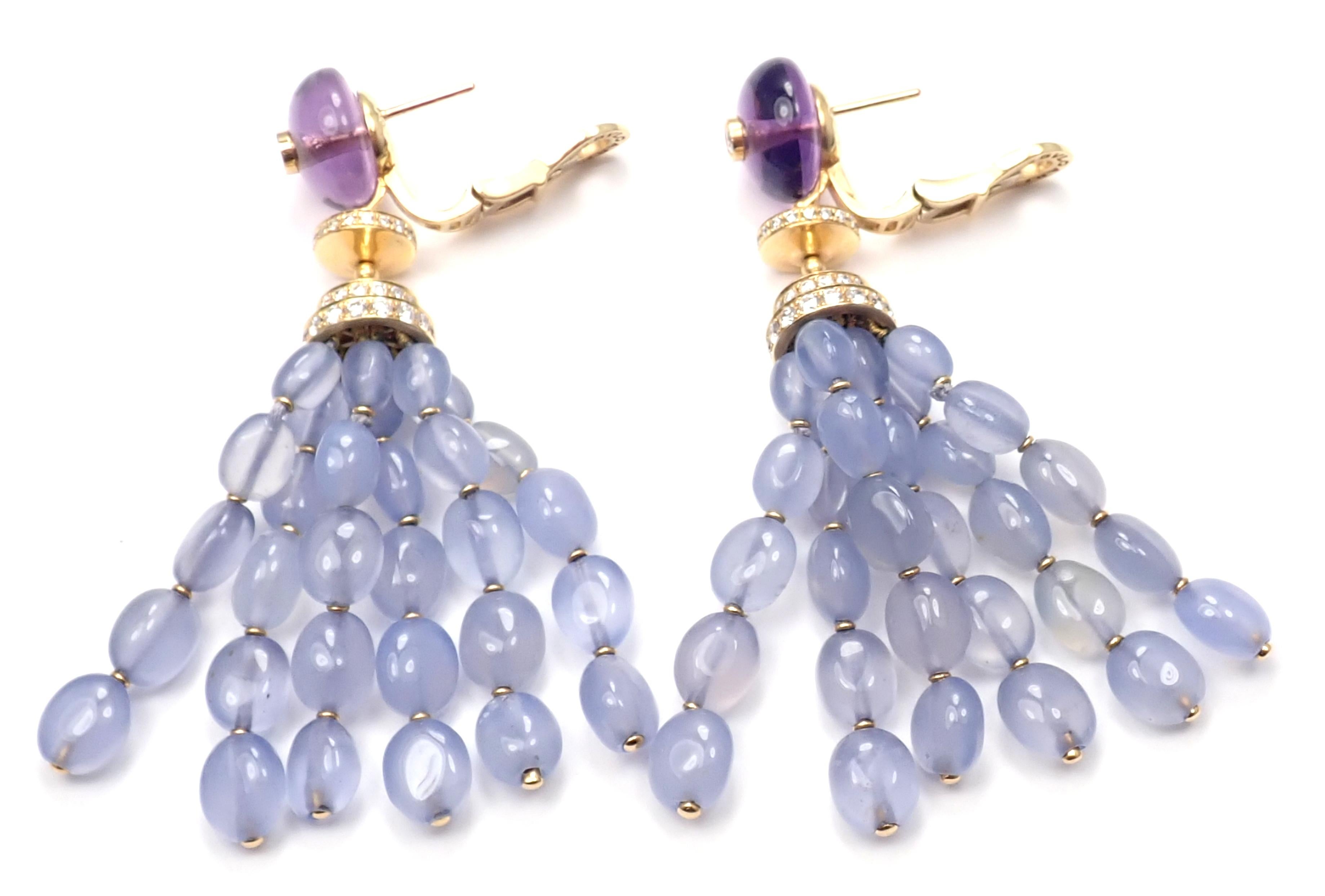 18k yellow gold diamond, Chalcedony, Amethyst drop earrings by Bulgari.
Round brilliant cut diamonds VS1 clarity G color total weight approx. 1.5ct
2 Amethyst stones
Chalcedony stones
Detail:
Measurements: 2.5