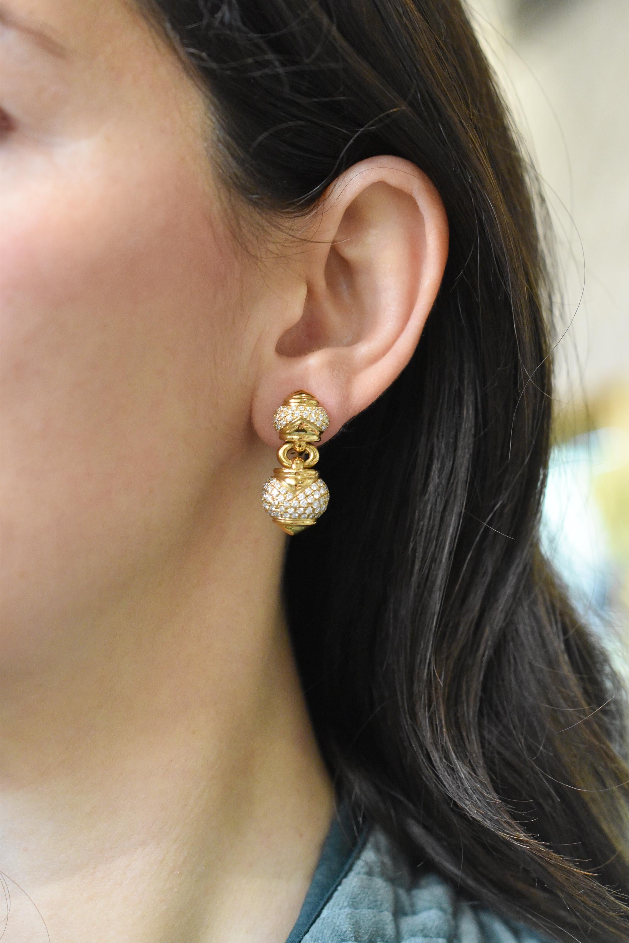 A timeless pair of Bulgari Diamond ‘Chandra’ Drop Earrings in 18k yellow gold, each abstract heart-shaped section accented with pavé-set brilliant-cut diamonds for a total weight of approximately 2.00 carats. 
Made in Italy, circa 1990.

Signed