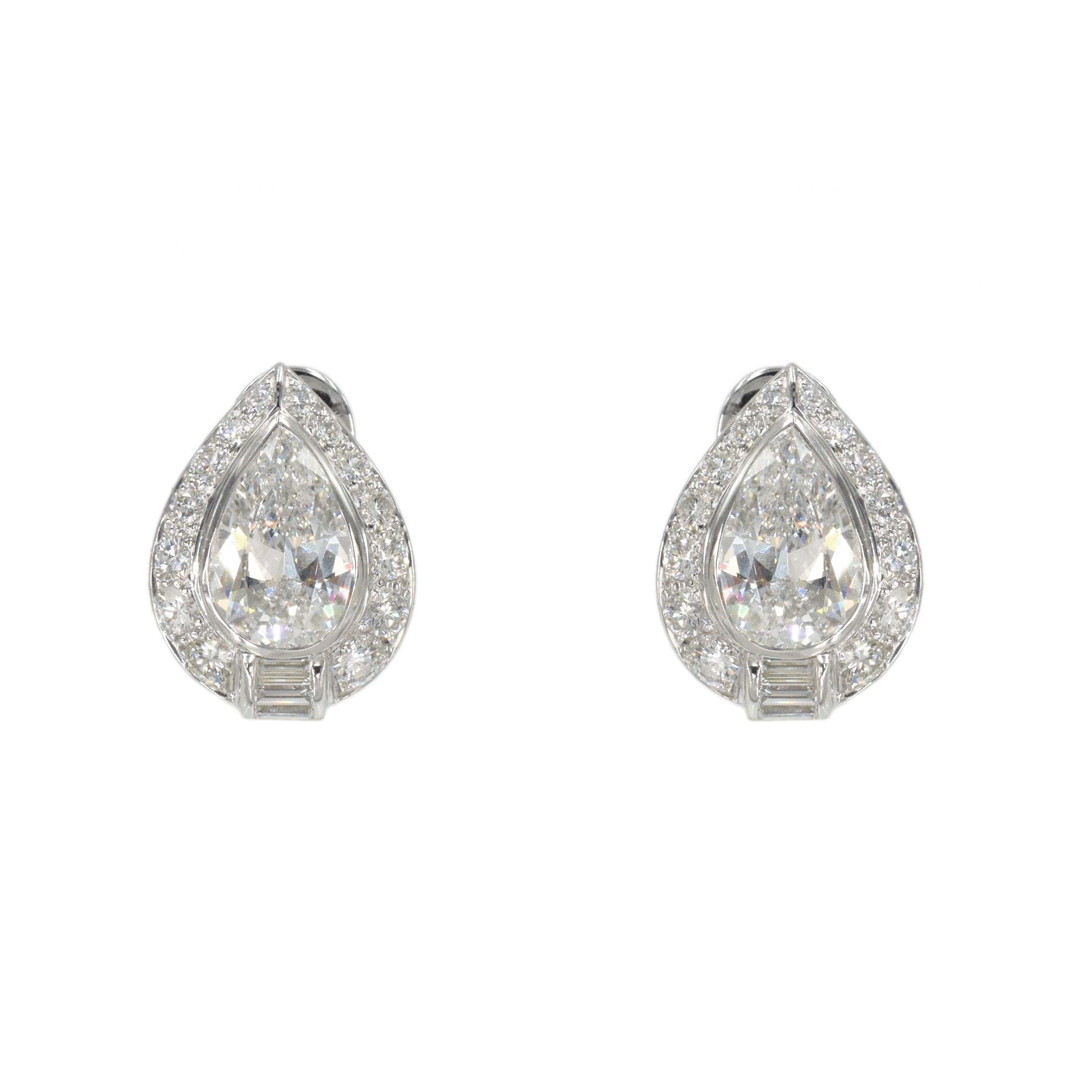 Diamond and Platinum Earrings, Bulgari This pair of earrings has 2 pear shape center
diamonds weighing a total of 2.70 carats (1.36 carat, Color: E, Clarity: VS1, GIA#1216316941 and
1.34carat Color: E, Clarity: VS1, GIA#2211316939) surrounded by