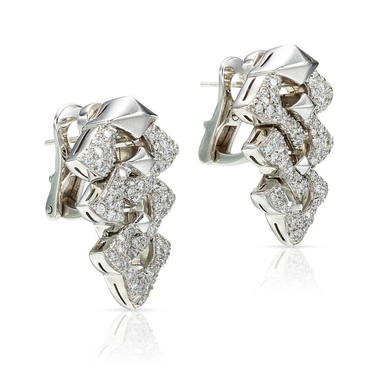 Beautifully crafted pair of Bulgari earrings in 18 karat white gold and featuring approximately 2 carats of glittering white diamonds. Bulgari’s masterful design features 3-tiers of white gold interlocking links set with highest quality diamonds (F