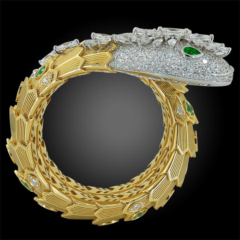 An 18k white and yellow serpenti gold bracelet, set with pave diamond weighing approx. 18.90 cts. and round and emerald weighing approx. 1.64 cts.
Signed Bulgari
With box and papers