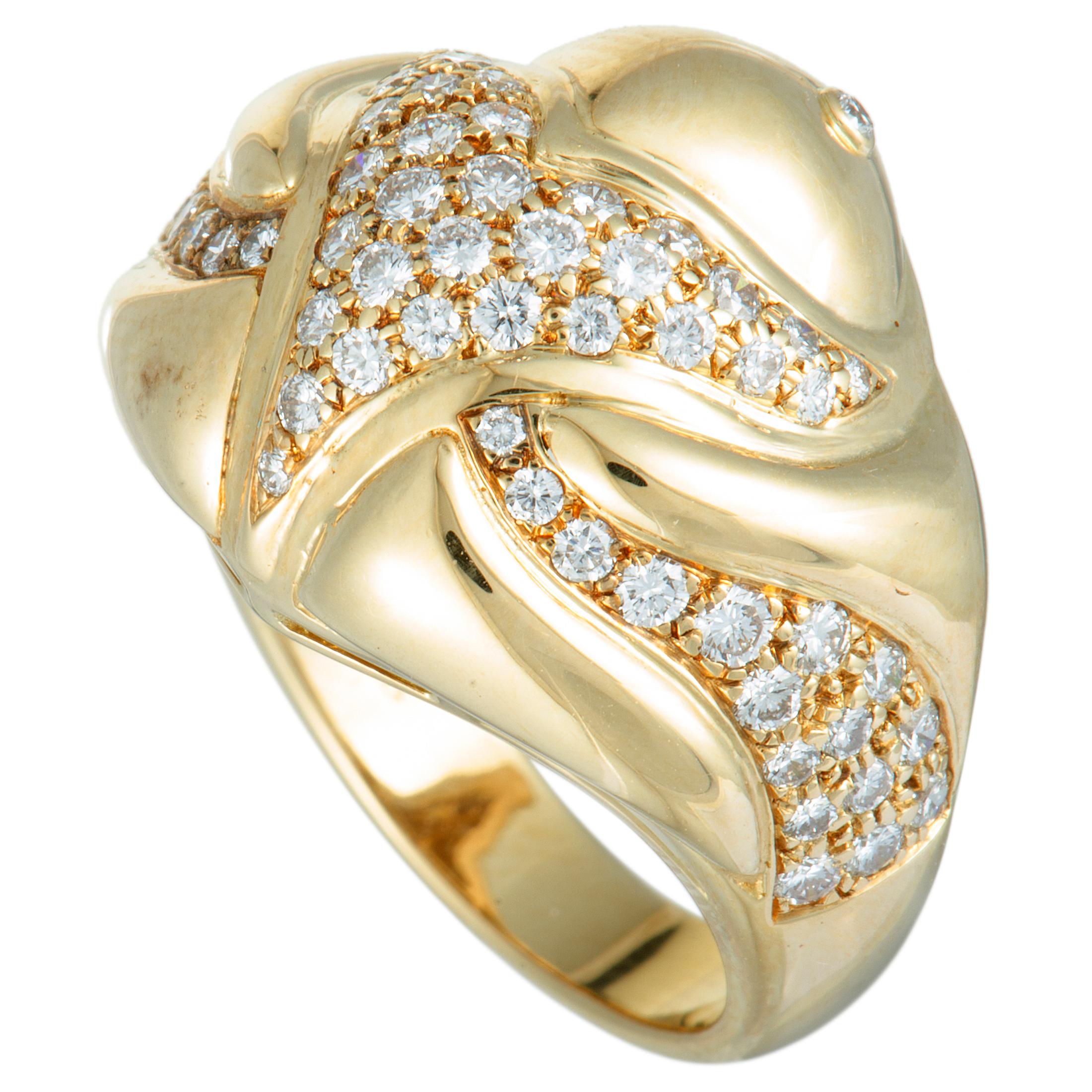 Beautifully set against the enchantingly radiant 18K yellow gold, the incredibly lustrous diamonds add to the compellingly luxurious appeal of this marvelous ring. The ring is wonderfully designed by Bvlgari and it is set with colorless (grade E)