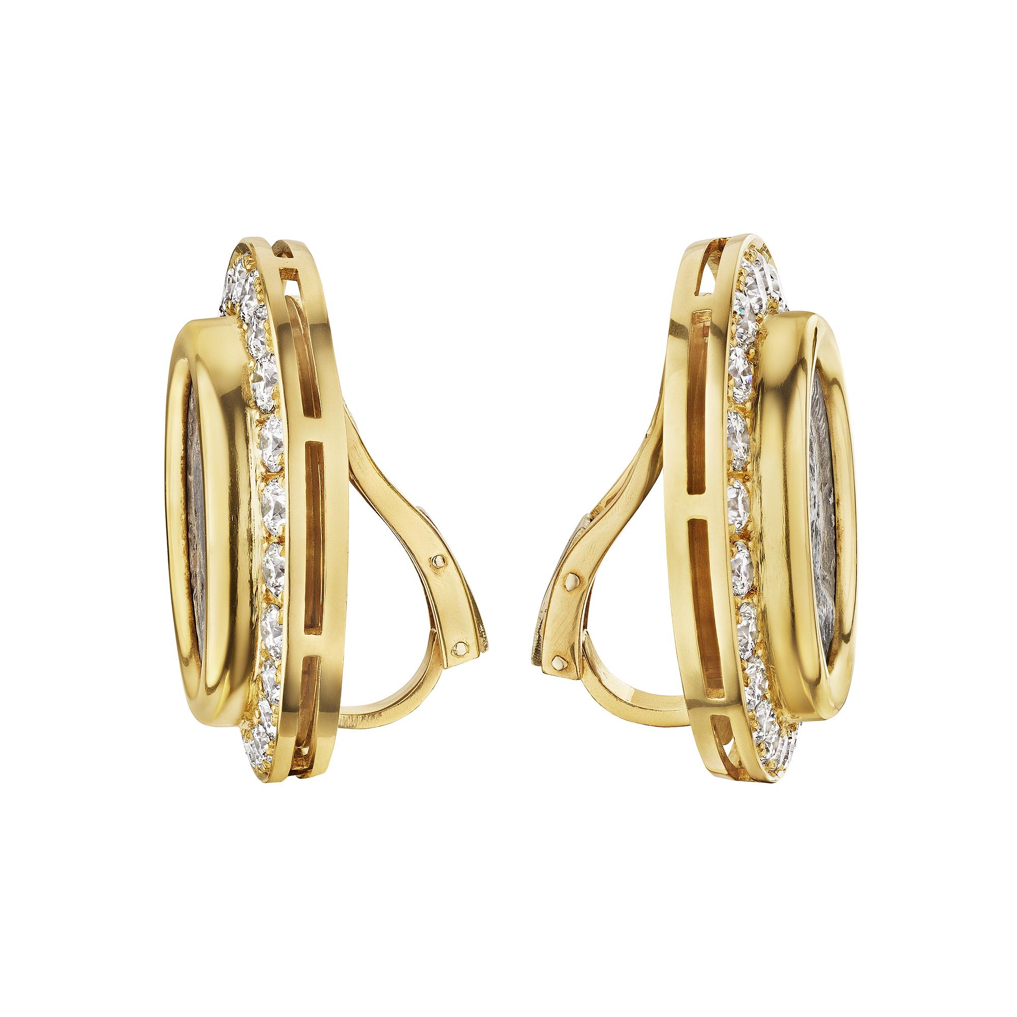 There is always two sides to a coin and wear both with these Bulgari diamond gold ancient coin clip earrings.  Framed by round brilliant cut sizzling diamonds, each ancient Roman coin pops with one-of-a-kind style.  Signed Bulgari.  Back frame