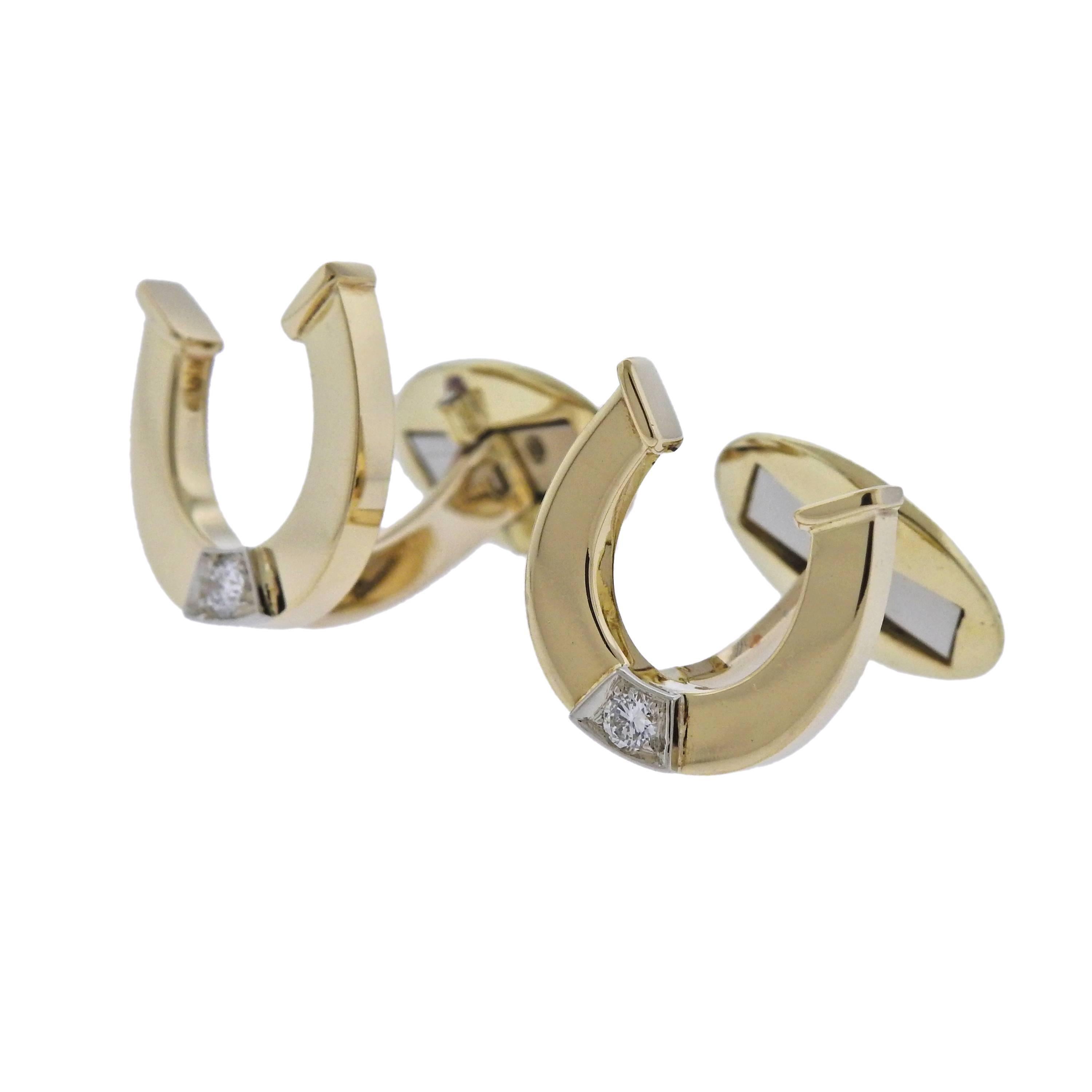  Pair of 18k yellow gold horseshoe cufflinks, each adorned with an approx. 0.05ct diamond in the center, crafted by Bulgari. Cufflink top is 15mm x 16mm, weight - 11 grams. Marked: Bvlgari, 750, C1568.