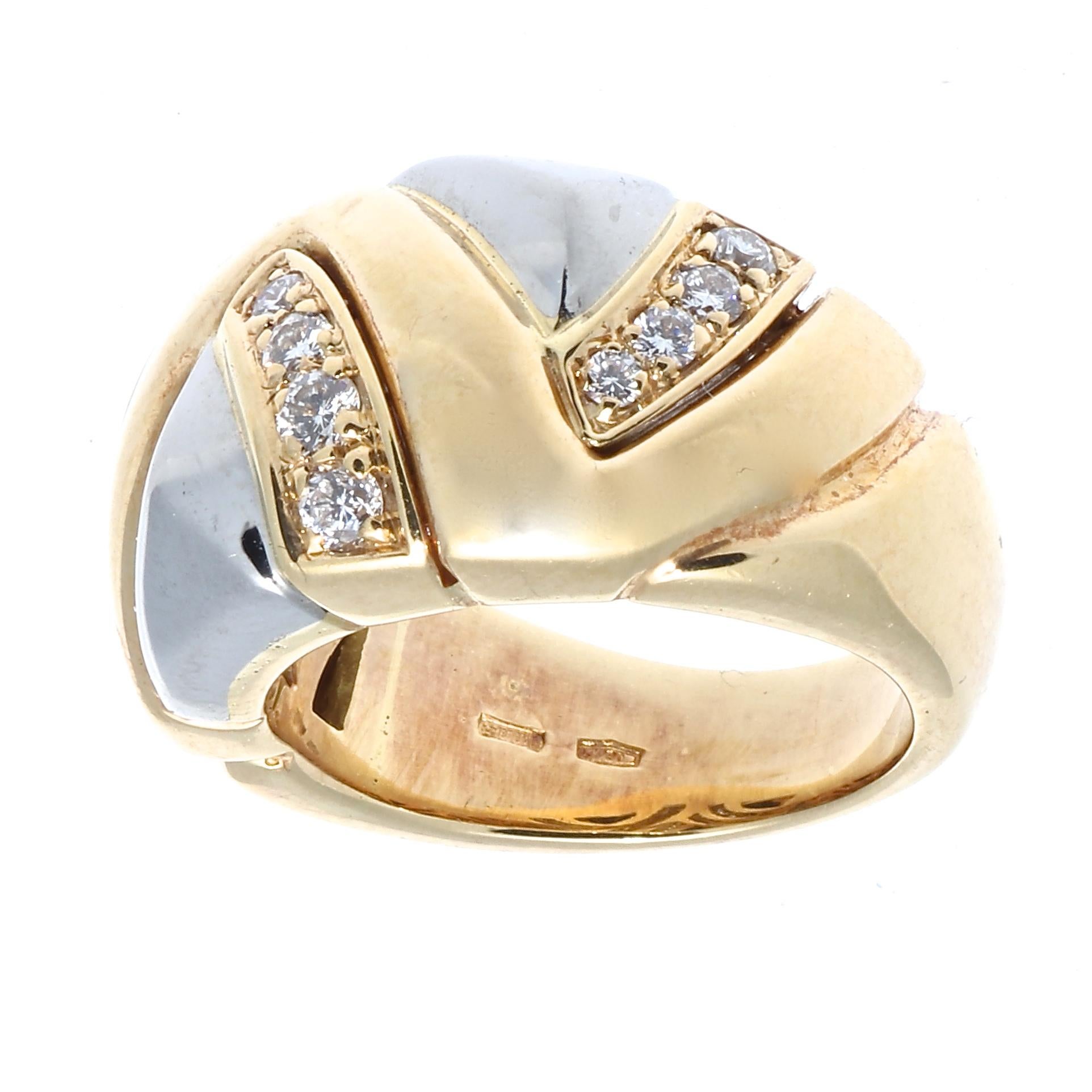 During the 80's & 90's Bulgari's design crystalized into a recognizable image of gold, volume, color and clean shapes. This ring features uniquely weaving white and yellow gold and columns of diamonds. Signed Bvlgari and numbered.

Ring size 5-1/2