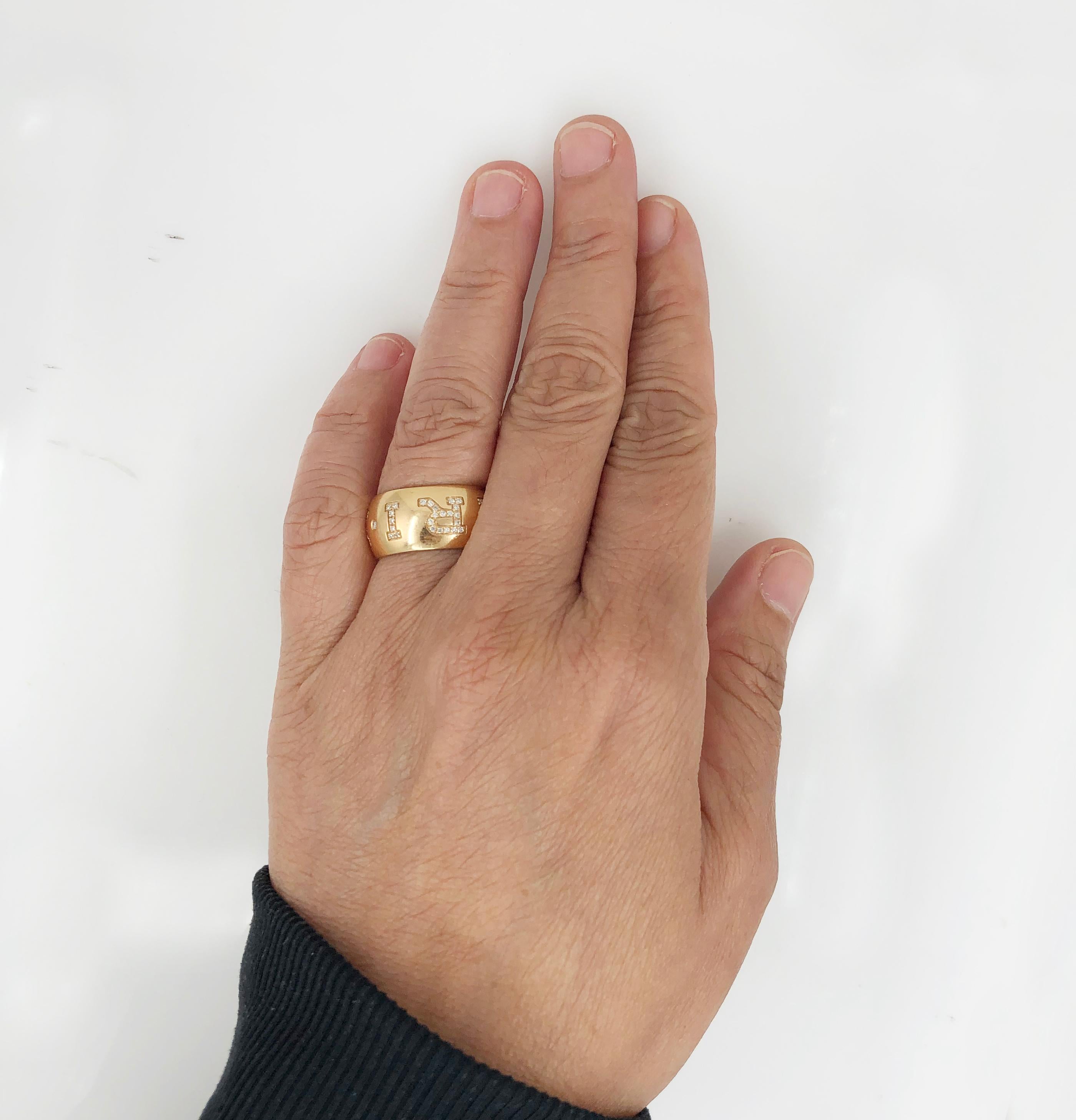 Ladies 18k rose gold Bvlgari Monologo ring with inlaid logo embellished with round brilliant cut diamonds. 
Signed Bvlgari, 
size 54. (6.75 US)
Condition: Good - Previously owned and gently worn, with little signs of use. May show light scratches