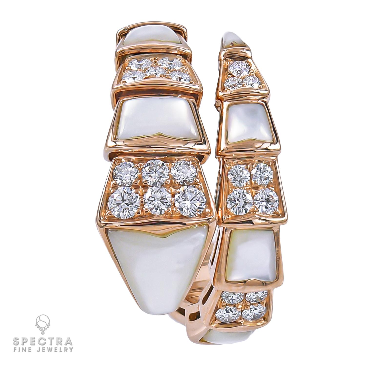 A Bulgari Viper ring made with diamonds and mother-of-pearl.
18k rose gold, gross weight is 10.11 gr.
Stretchable, size L, fits sizes 6.5-8.
Serial number will be provided to potential buyers.
Comes with a Bulgari box.