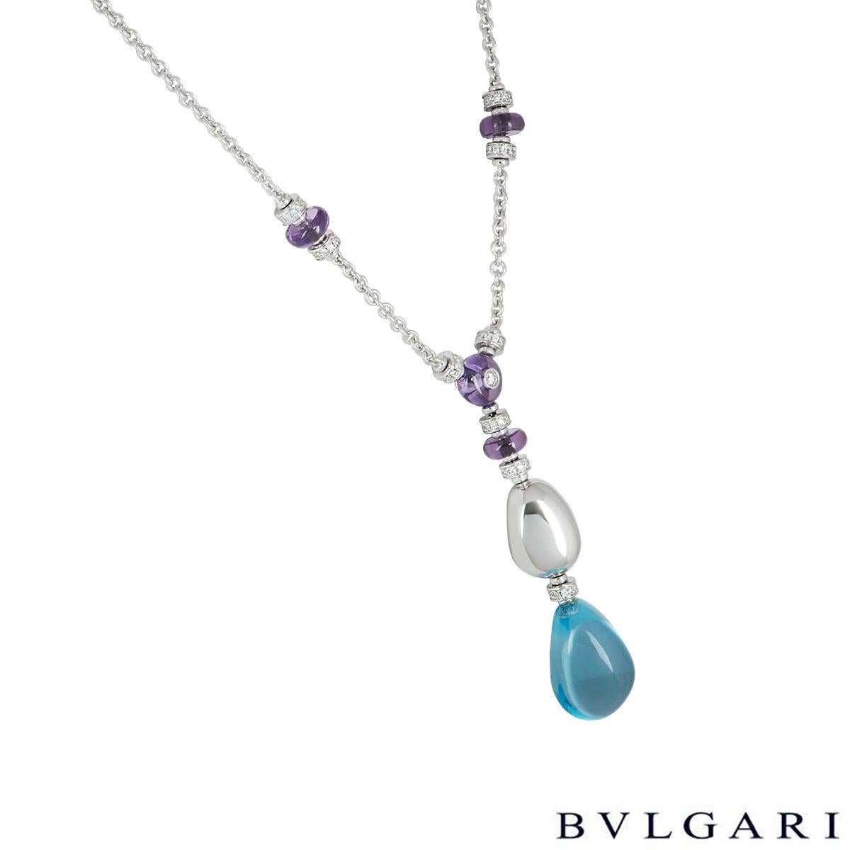 A beautiful 18k white gold necklace by Bvlgari from the Mediterranean Eden collection. The necklace comprises of a cabochon cut topaz with a round brilliant cut diamond placed in the middle. Suspended beneath it are diamond set discs with a amethyst