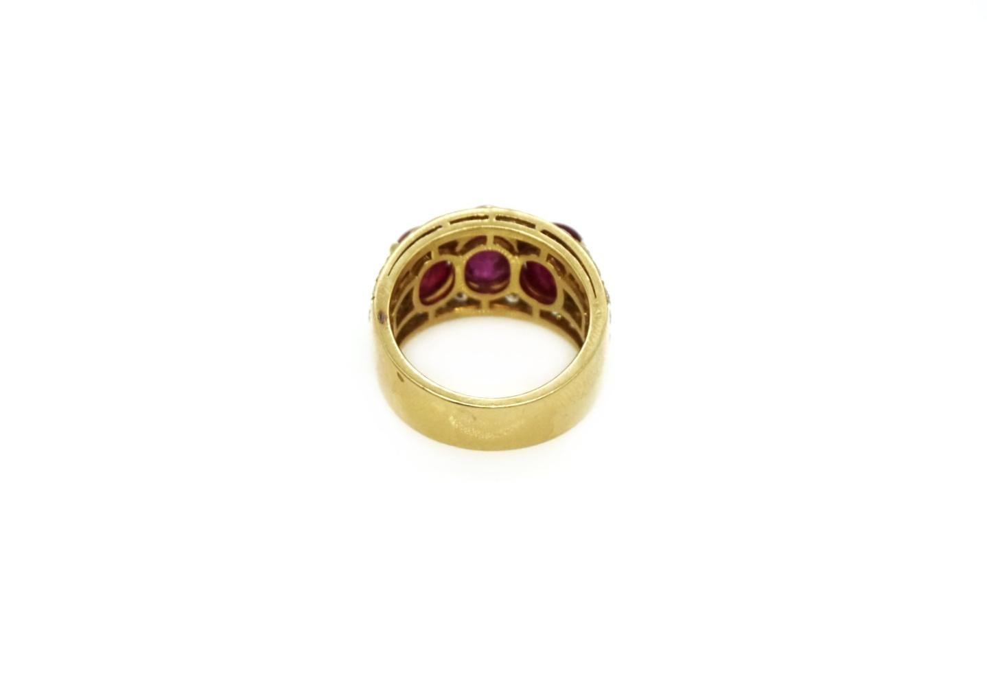 Bulgari 18 karat yellow gold ring with 3 cabochon rubies totaling approximately 7.61 carats and round brilliant diamonds. Made in Italy,  circa 1970.