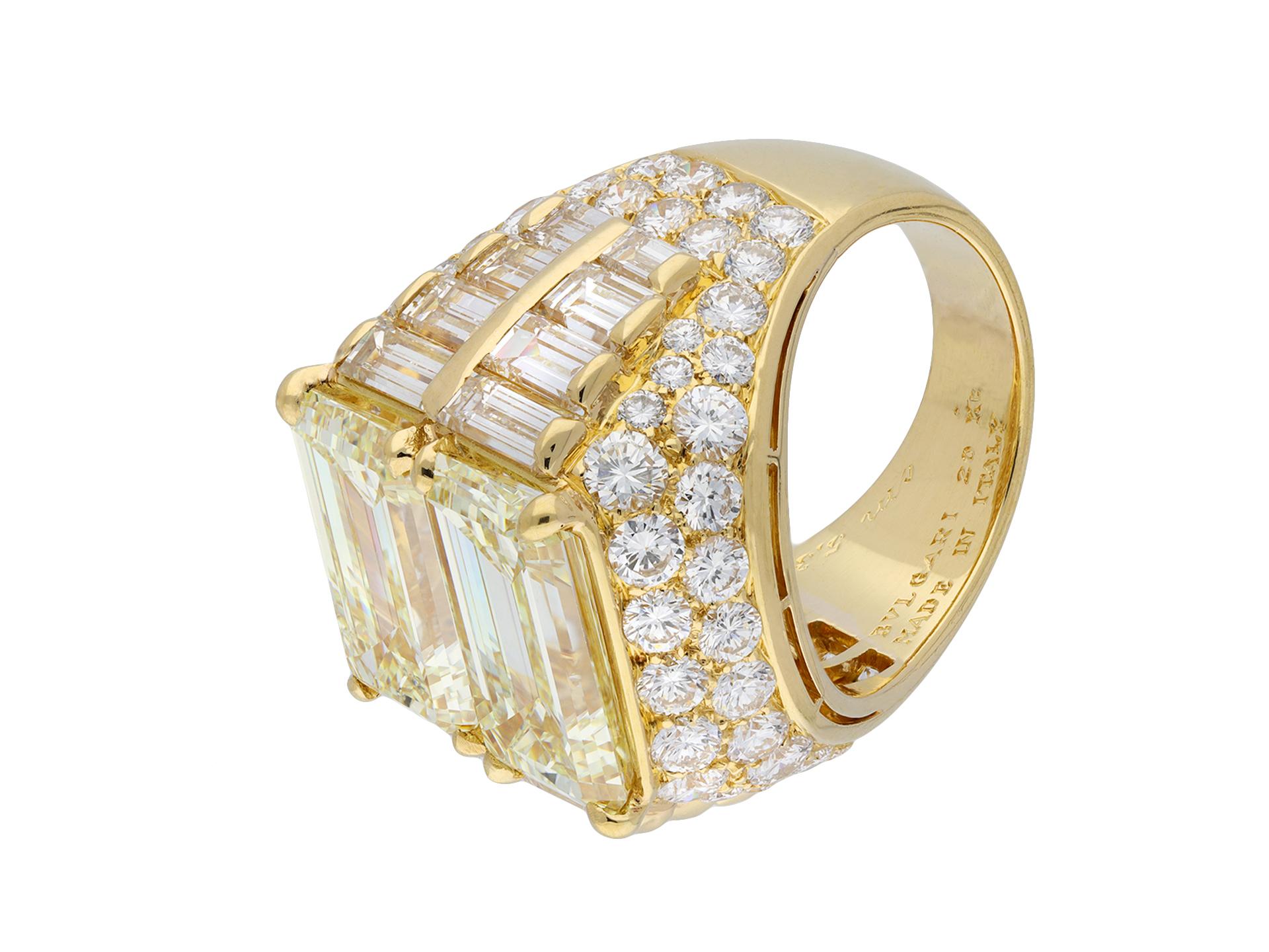 Bulgari diamond 'Trombino' ring. An important piece, set horizontally to centre with two emerald-cut diamonds in open back claw settings with an approximate combined weight of 10.16 carats, flanked by sixteen vertically set rectangular baguette cut