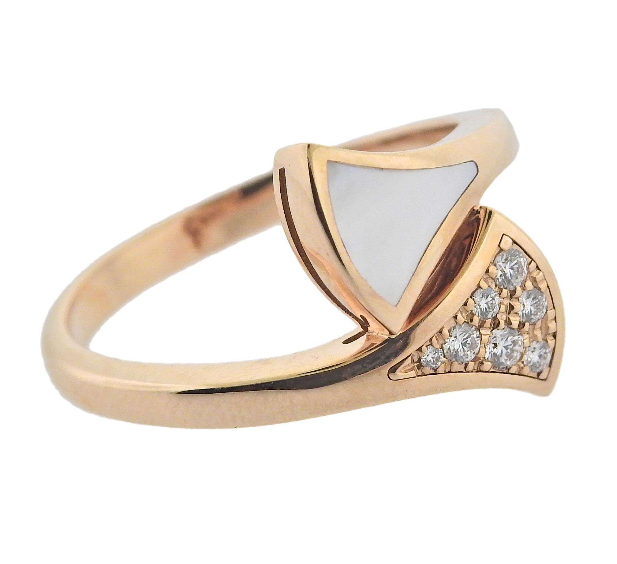18k rose gold Bvlgari Diva's Dream ring, with 0.20ctw G/VS diamonds and mother of pearl. Retail $2170. Comes with COA and box. Ring size 6, top is 14mm wide. Marked Bvlgari, made in Italy, Italian mark, 750, Serial number. Weight 4.1 grams