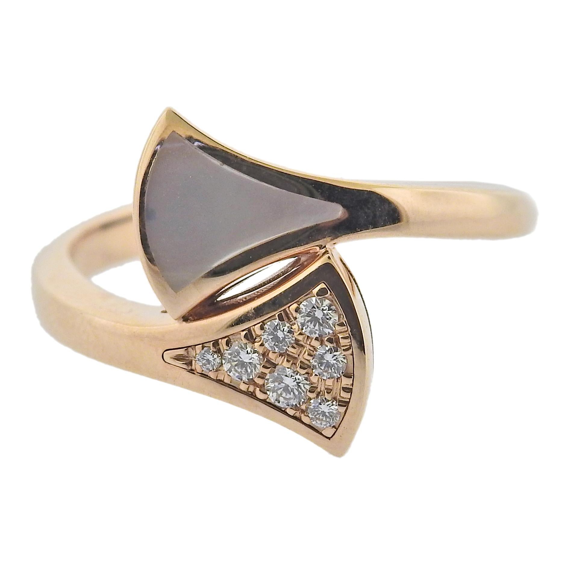 18k rose gold Bvlgari Diva's Dream ring, with 0.20ctw G/VS diamonds and mother of pearl. Ring size 52, top measures 14mm wide. Marked: Bvlgari, Made in Italy, Italian mark, 750, Serial Number. Weight is 4.1 grams. Retail $2170. Comes with COA and