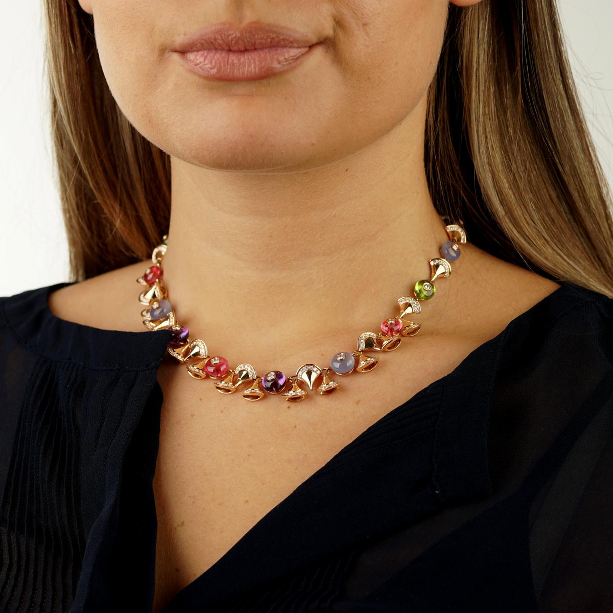 A magnificent Bulgari Divas Dream necklace adorned with 13.7ct Amethyst, Peridot totaling 11.45 carats, Rubellite totaling 8.90 carats, and round chalcedony totaling 10.80 carats. 
The diamonds total 3.45ct of the finest Bulgari round brilliant cut