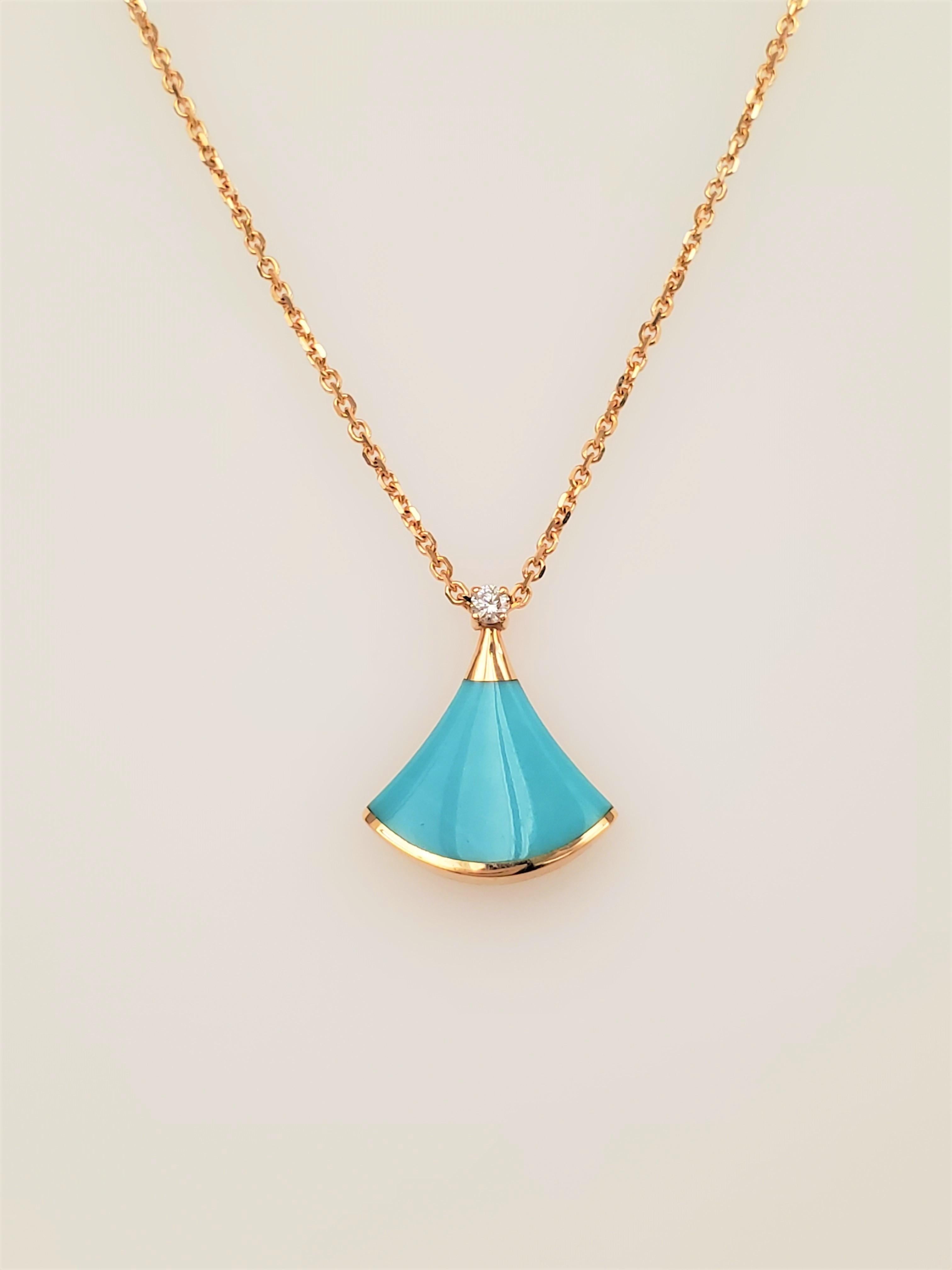 Authentic Bulgari necklace crafted in 18 karat rose gold featuring a fan-shaped turquoise pendant, set with 1 round brilliant diamond weighing approximately .04ct.  The chain measures 17 inches in total length and is worn at an 8 inch drop.  Pendant
