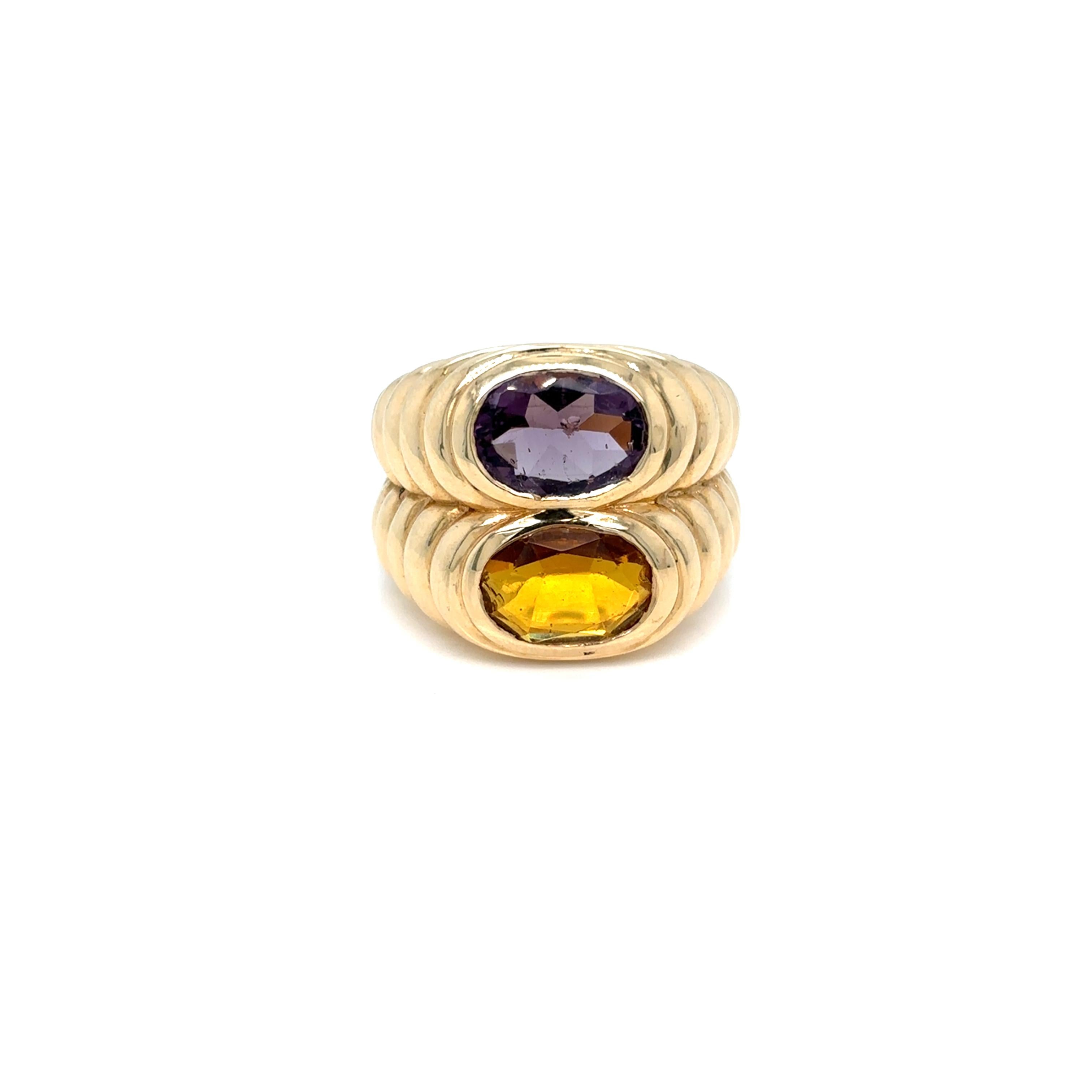 Bulgari Doppio Baccellato iconic ring, made of 18 yellow gold and set with natural oval shaped Citrine & Amethyst. Circa 1980’
Size 52, resizable, total weight 14.85 grams

Stamped, with the maker's mark, the Italian gold assay hallmark and signed,