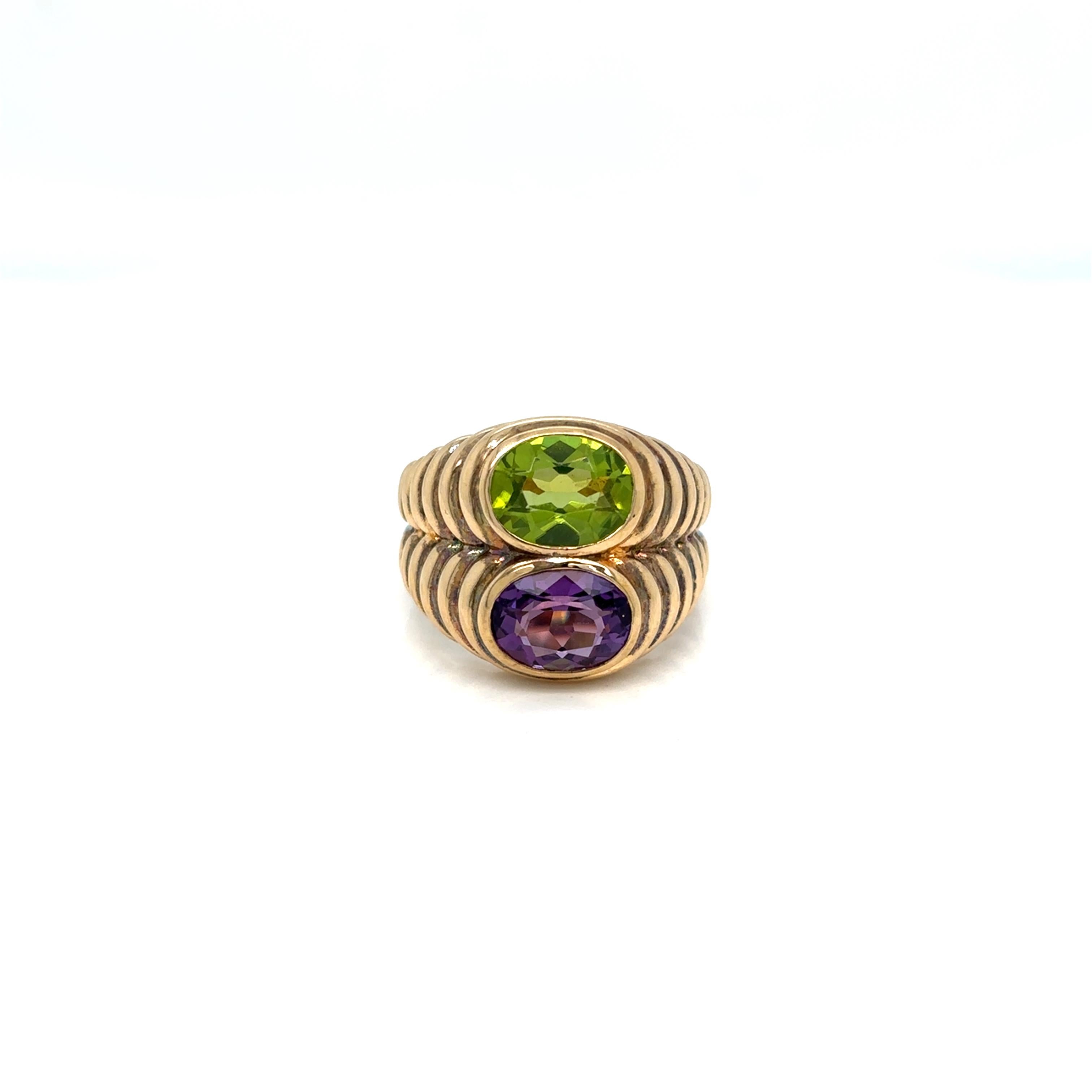 Bulgari Doppio Baccellato iconic ring, made of 18 yellow gold and set with natural oval shaped Peridot & Amethyst. Circa 1980’
Size 7, resizable, total weight 11.8 grams

Stamped, with the maker's mark, the Italian gold assay hallmark and signed,
