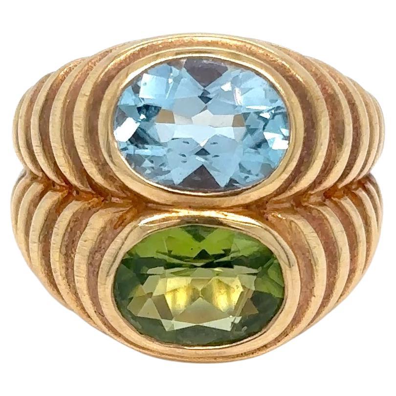 Bulgari Bague Doppio Baccellato en or jaune 18 carats avec topaze bleue et péridot