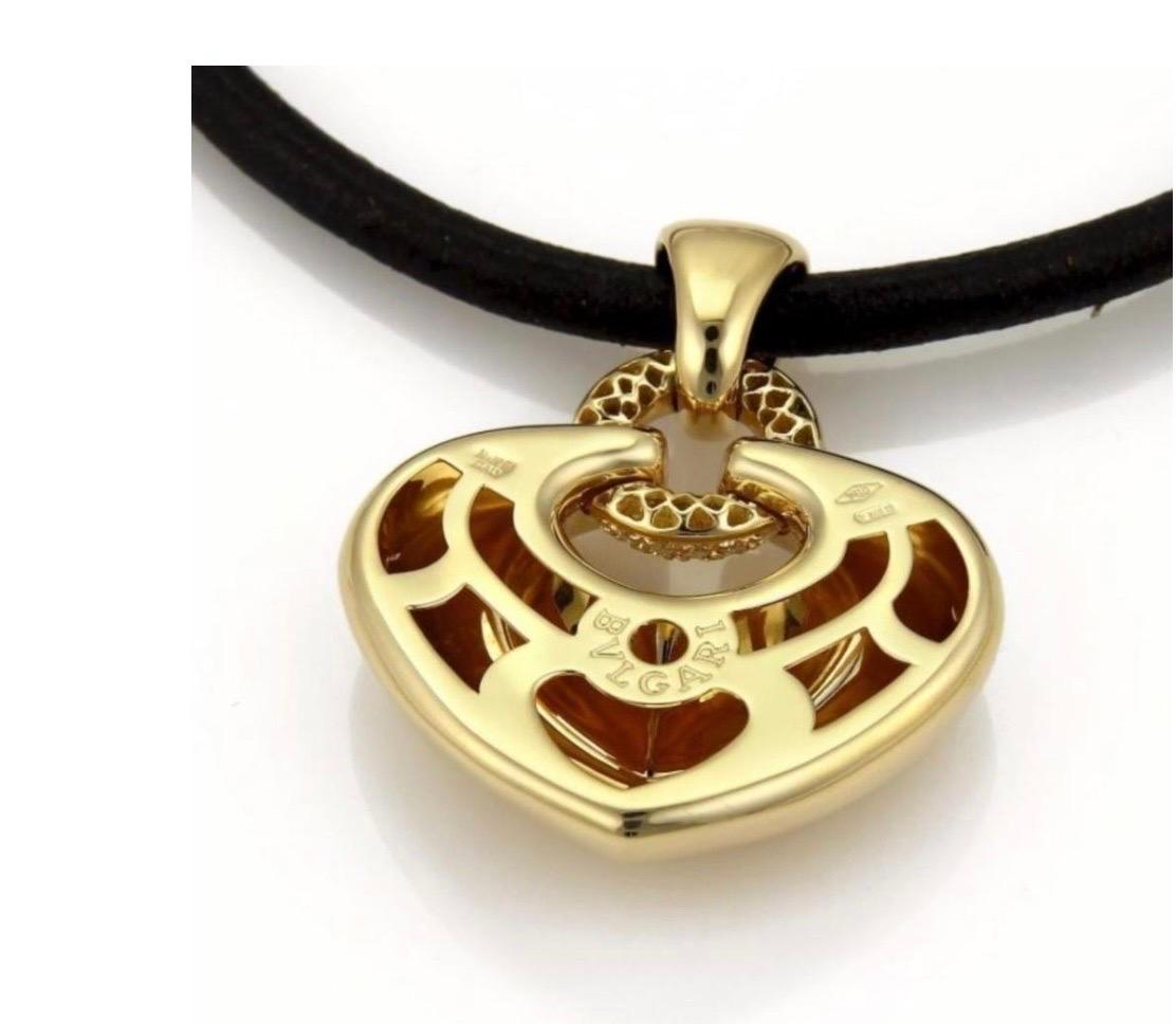 Round Cut Bulgari 'Doppio Cuore' Gold and Diamond Puffed Heart Pendant on the Leather Cord