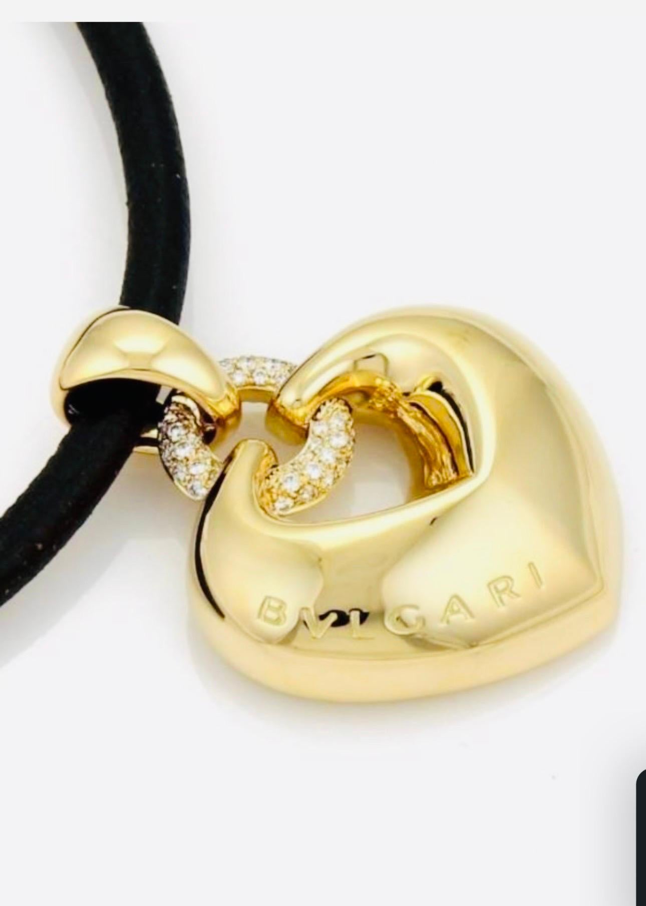 Round Cut Bulgari 'Doppio Cuore' Gold and Diamond Puffed Heart Pendant on the Leather Cord