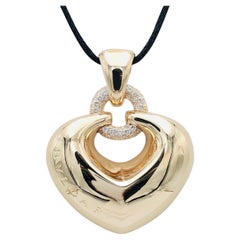 Bulgari 'Doppio Cuore' Gold and Diamond Puffed Heart Pendant on the Leather Cord