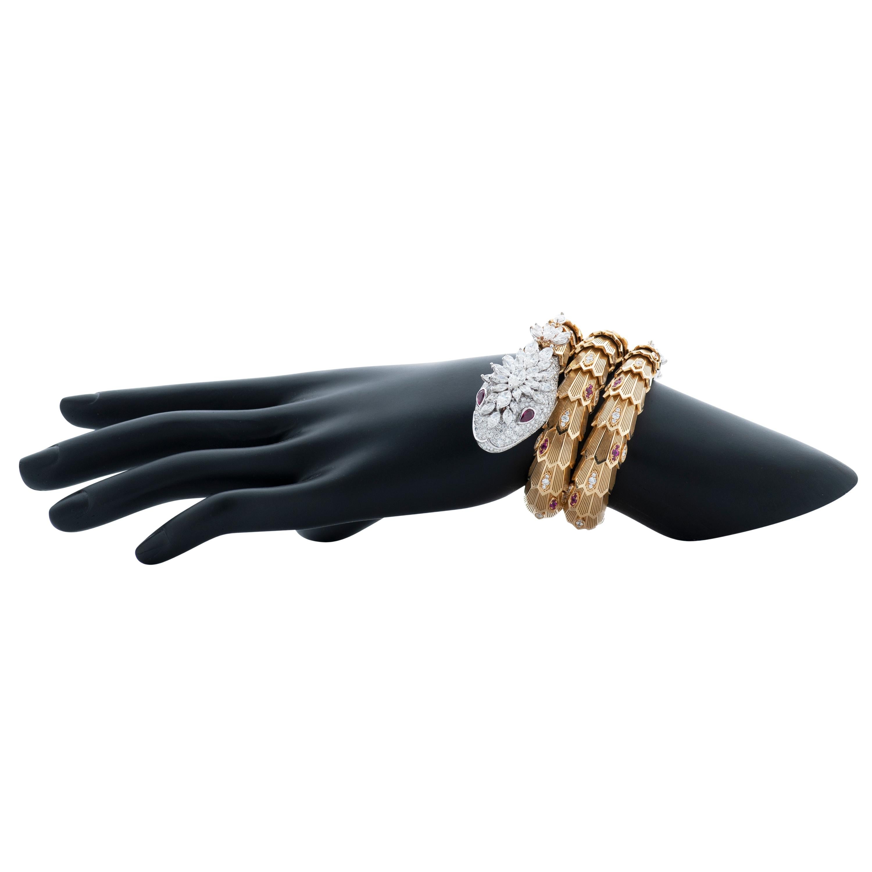Bulgari double coil Serpenti snake bracelet in 18k yellow and white gold, accompanied by Bulgari box.

This bracelet features approximately 18.90 carats of marquise and round brilliant cut diamonds, as well as approximately 1.64 carats of pear shape