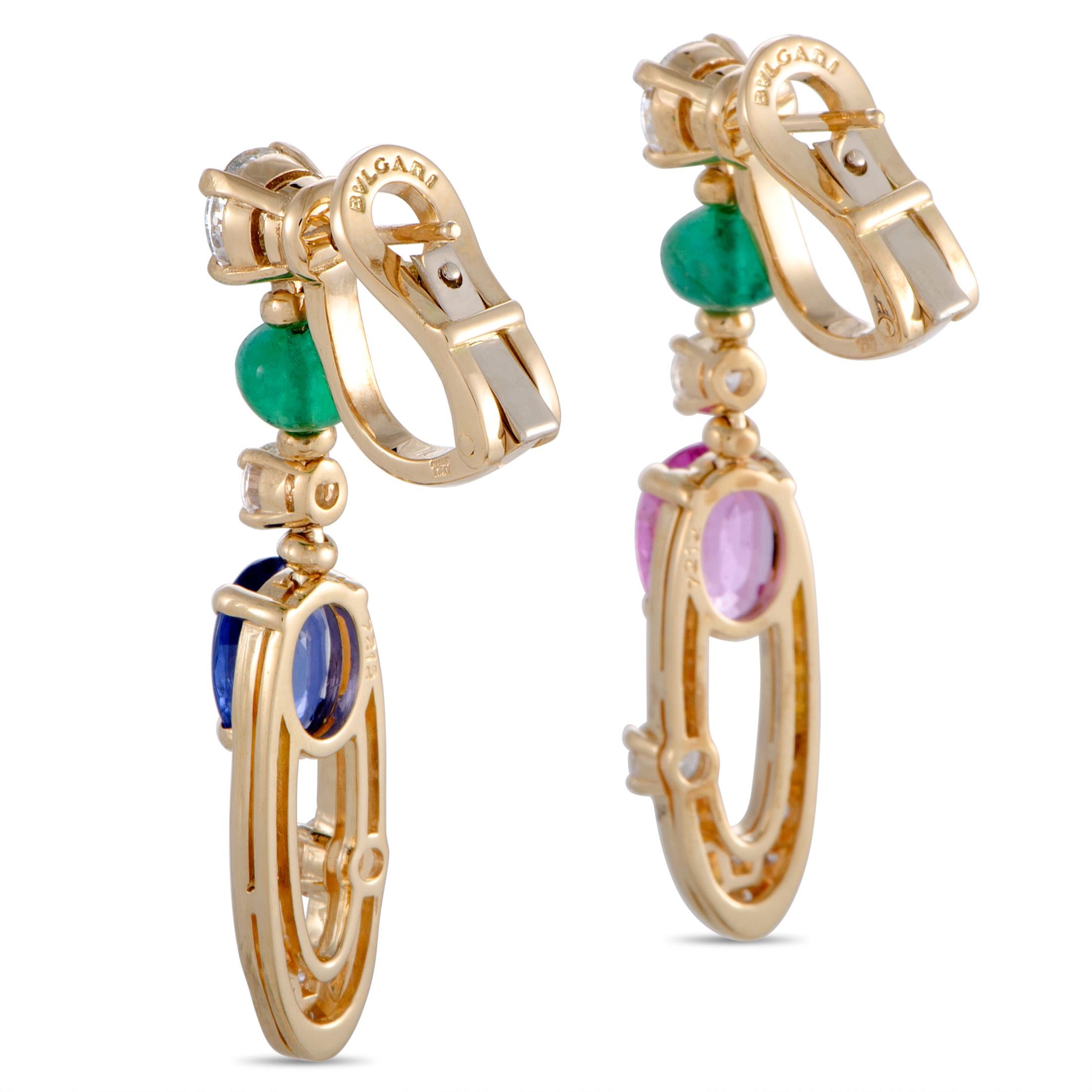 The Bvlgari “Elisia” earrings are made of 18K yellow gold and set with diamonds, emeralds, and blue and pink sapphires. The center diamonds boast grade G color and VS1 clarity and weigh 0.70 carats each (totaling 1.40 carats), while the side