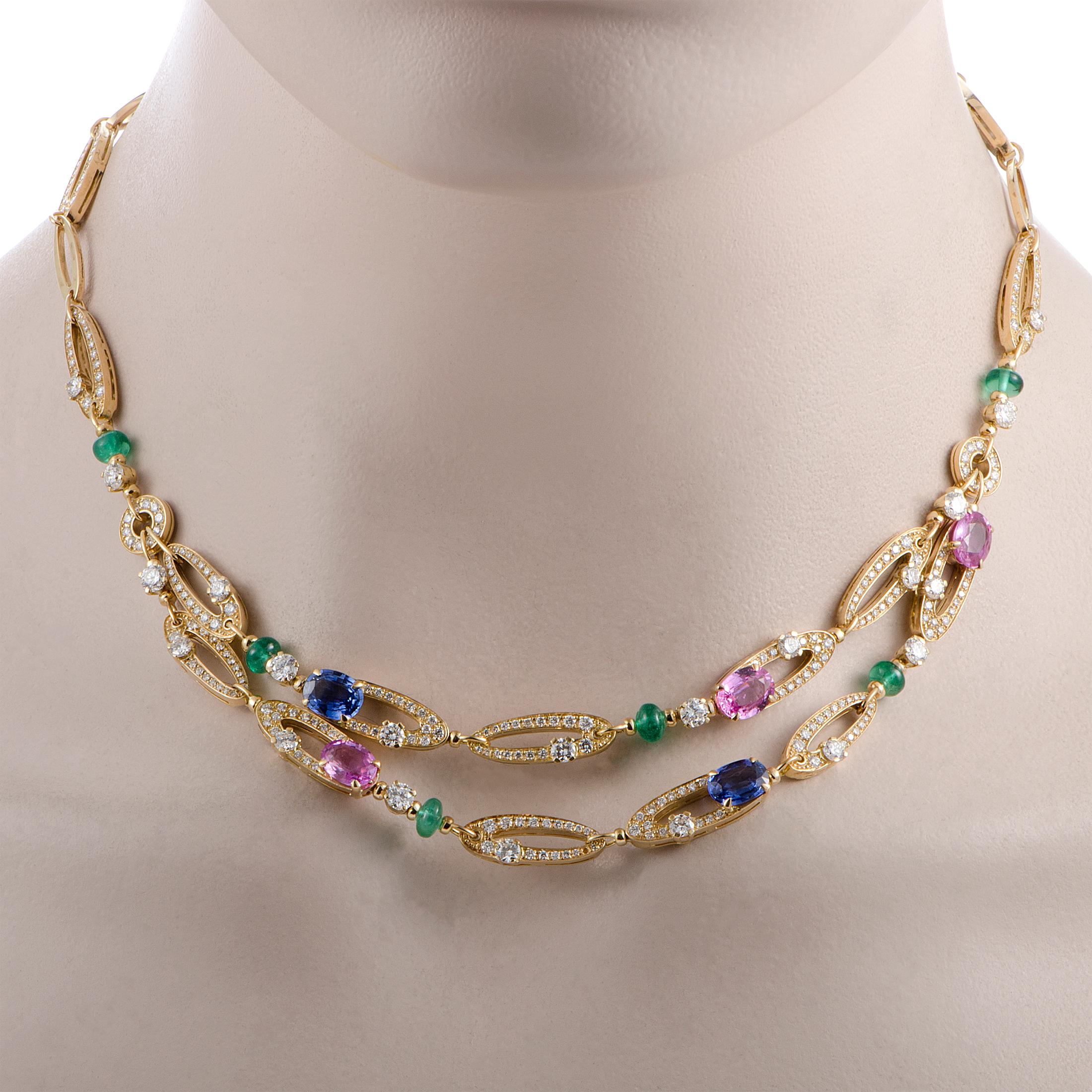 The Bvlgari “Elisia” necklace is crafted from 18K yellow gold and set with diamonds, emeralds and blue and pink sapphires. The diamonds boast grade E color and VS clarity and total approximately 6.00 carats, while the emeralds and sapphires amount