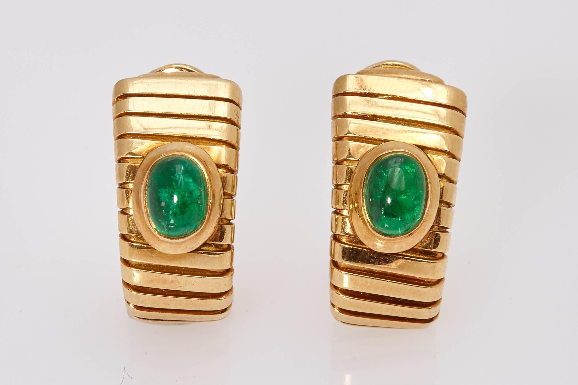 A pair of Bulgari Tubogas earclips, in 18kt yellow gold, showcasing two cabochon emeralds. Made in Italy, circa 1975 