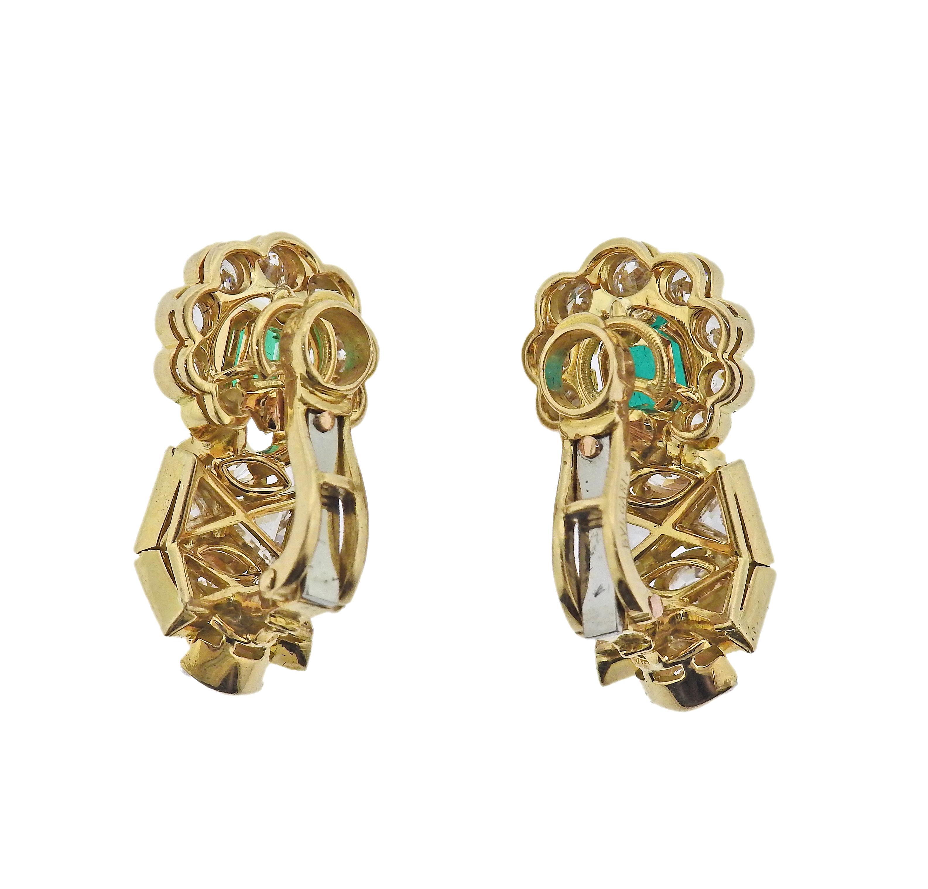 Pair of 18k gold earrings by Bvlgari, with approx. 1.10ct emerald each, surrounded with approx. 4.60-5.00ctw in mixed cut diamonds. Earrings measure 25mm x 14mm. Marked: Bvlgari, 750. Weight - 11.3 grams.