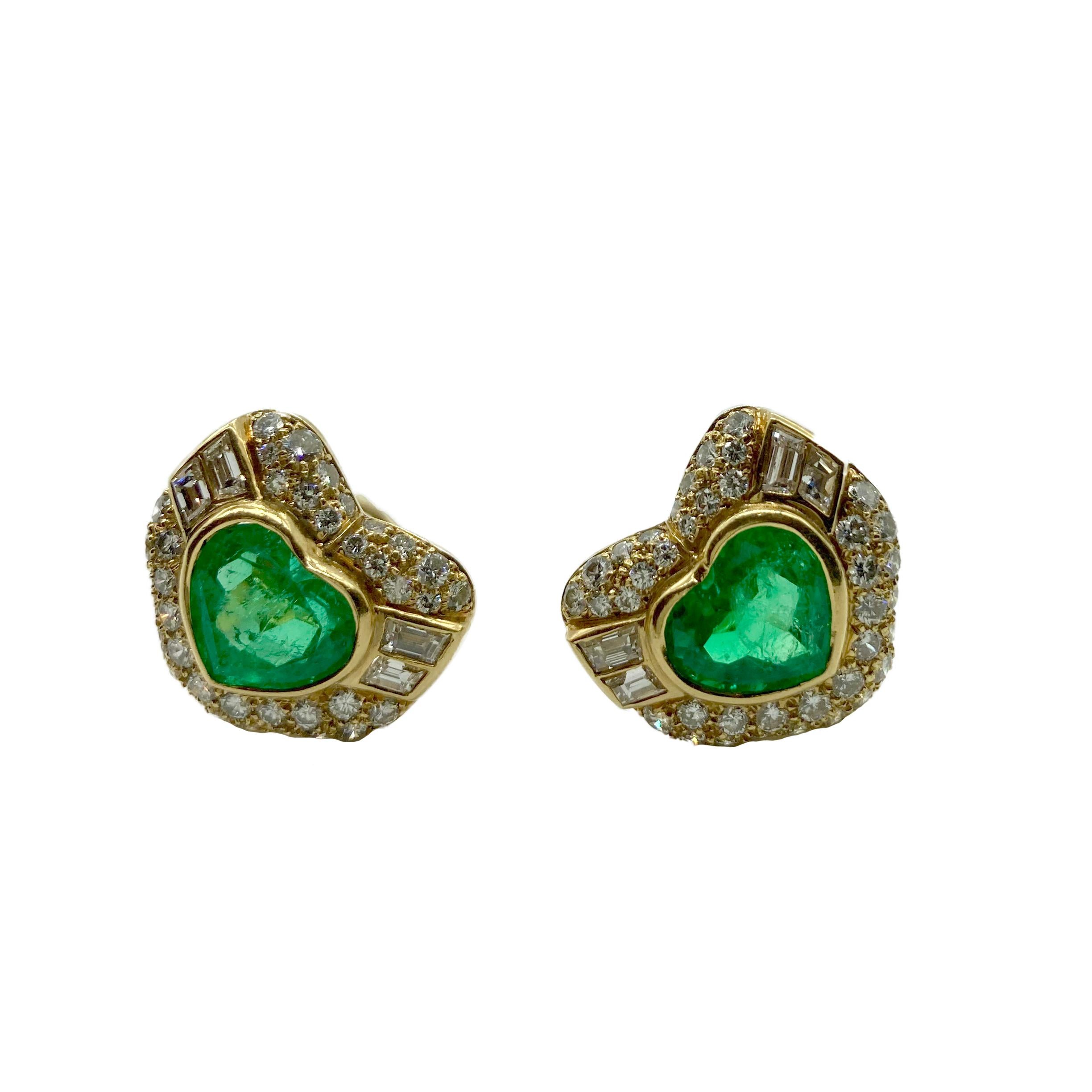A stunning pair of Bulgari earrings in 18 karat yellow gold with two heart-shaped emeralds, app. 2.4 cts each, and 4.5 carats of diamonds. Made in Italy, circa 1975.