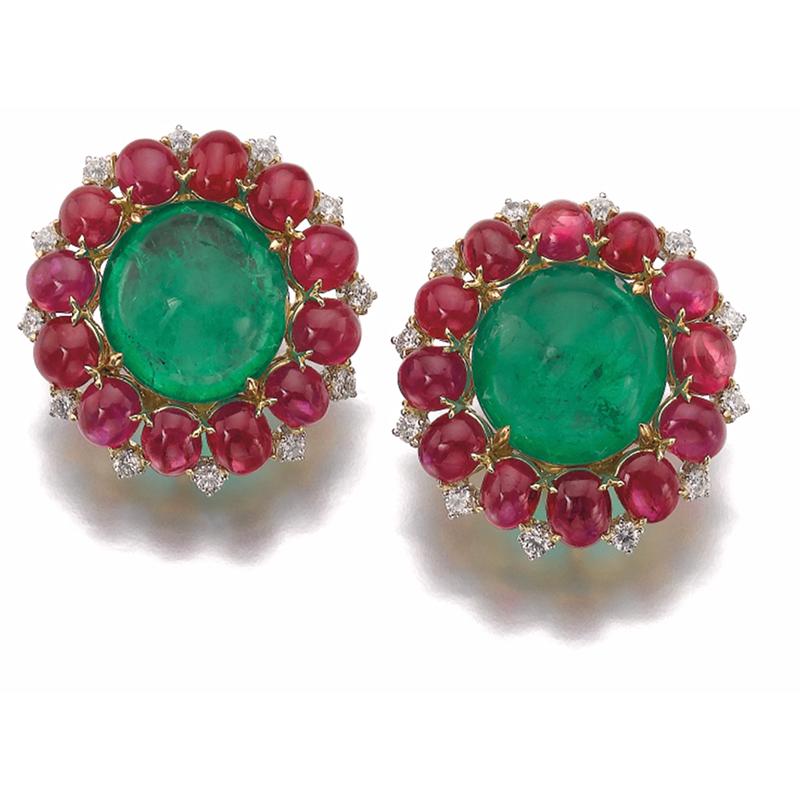 A beautiful pair of cabochon emerald, rubies and diamond ear-clips by Bulgari, iconic of the Dolce Vita period. Mounted on 18kt gold. Made in Italy, circa 1965. Total gross weight approximately 29 grams. Original box available.