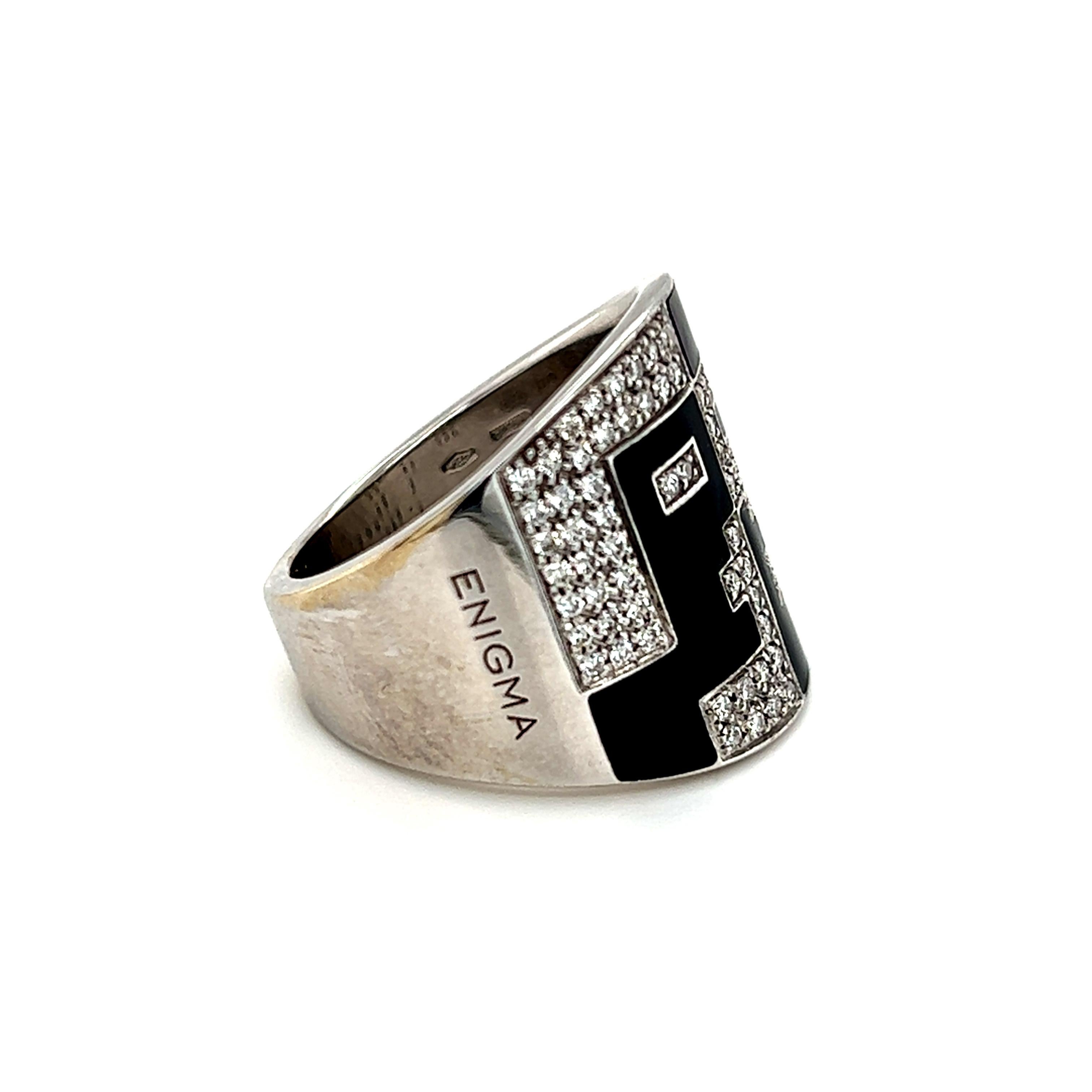 One 18-karat white gold high polished Bulgari ring from the ENIGMA collection featuring sixty-nine (69) round brilliant cut diamonds, weighing approximately 0.34-carat total weight with matching E-F color and VS clarity pave set in a geometric