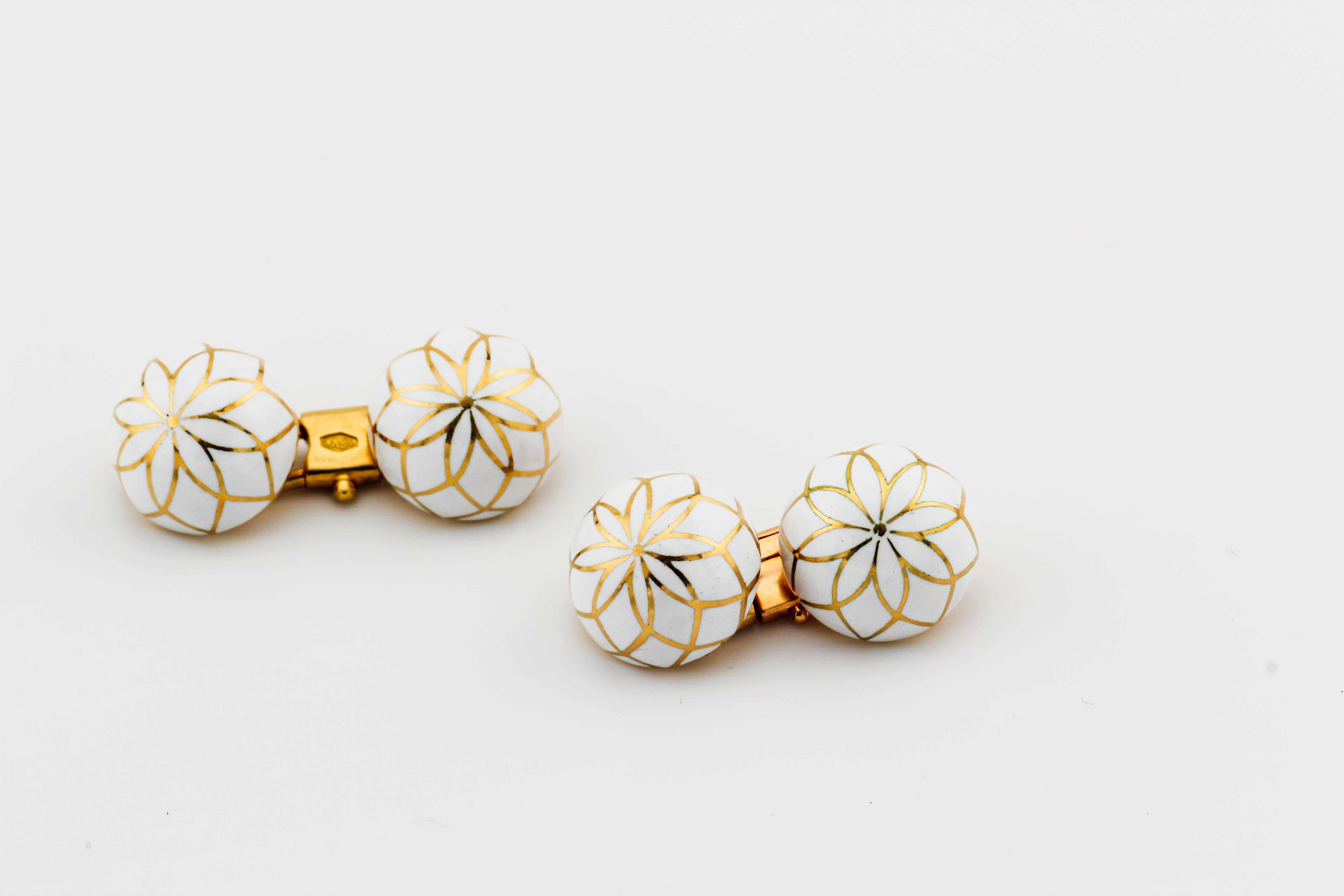 For your consideration, a fine pair of estate white enamel and 18k yellow gold cufflinks by Bulgari.

The white enamel and 18k yellow gold dome cufflinks by Bulgari, circa 1960s, are an exquisite example of the brand's timeless elegance and