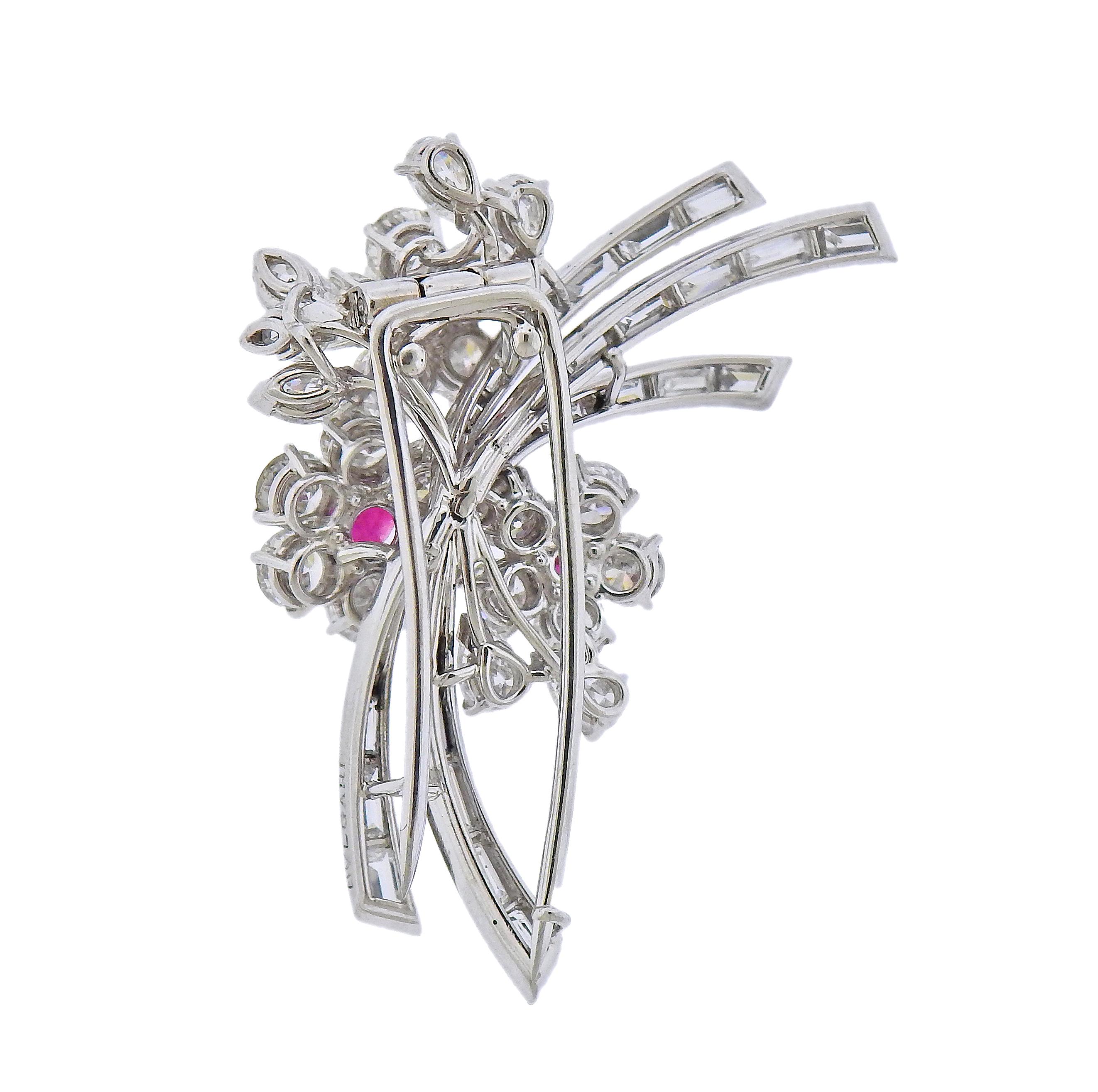 Platinum Bvlgari floral brooch, adorned with three round rubies - measuring approx. 4.4mm, 4.1mm and 4.95mm in diameter, surrounded with round , marquise, pear and baguette cut diamonds - total 5.50-6.00ctw. Brooch is 42mm x 26mm. Marked: Bvlgari.