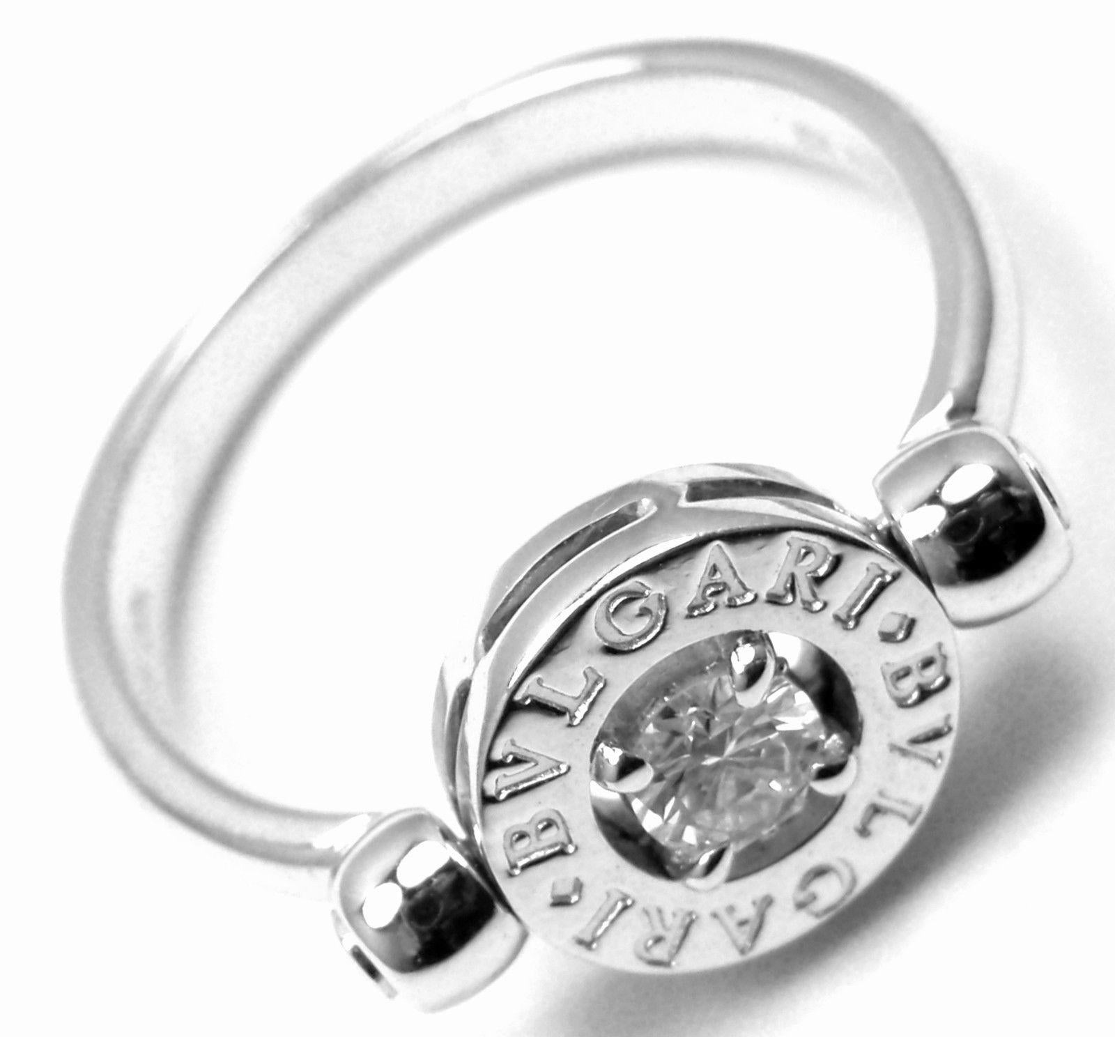 18k White Gold Diamond Flip Band Ring by Bulgari. 
With 1 Round brilliant cut diamonds VVS1 clarity, E color total weight approx. .25ct
Details:
Ring Size: 7
Weight: 5.1 grams
Width: 9mm
Stamped Hallmarks: Bvlgari, 750, Made In Italy, 2337AL
*Free