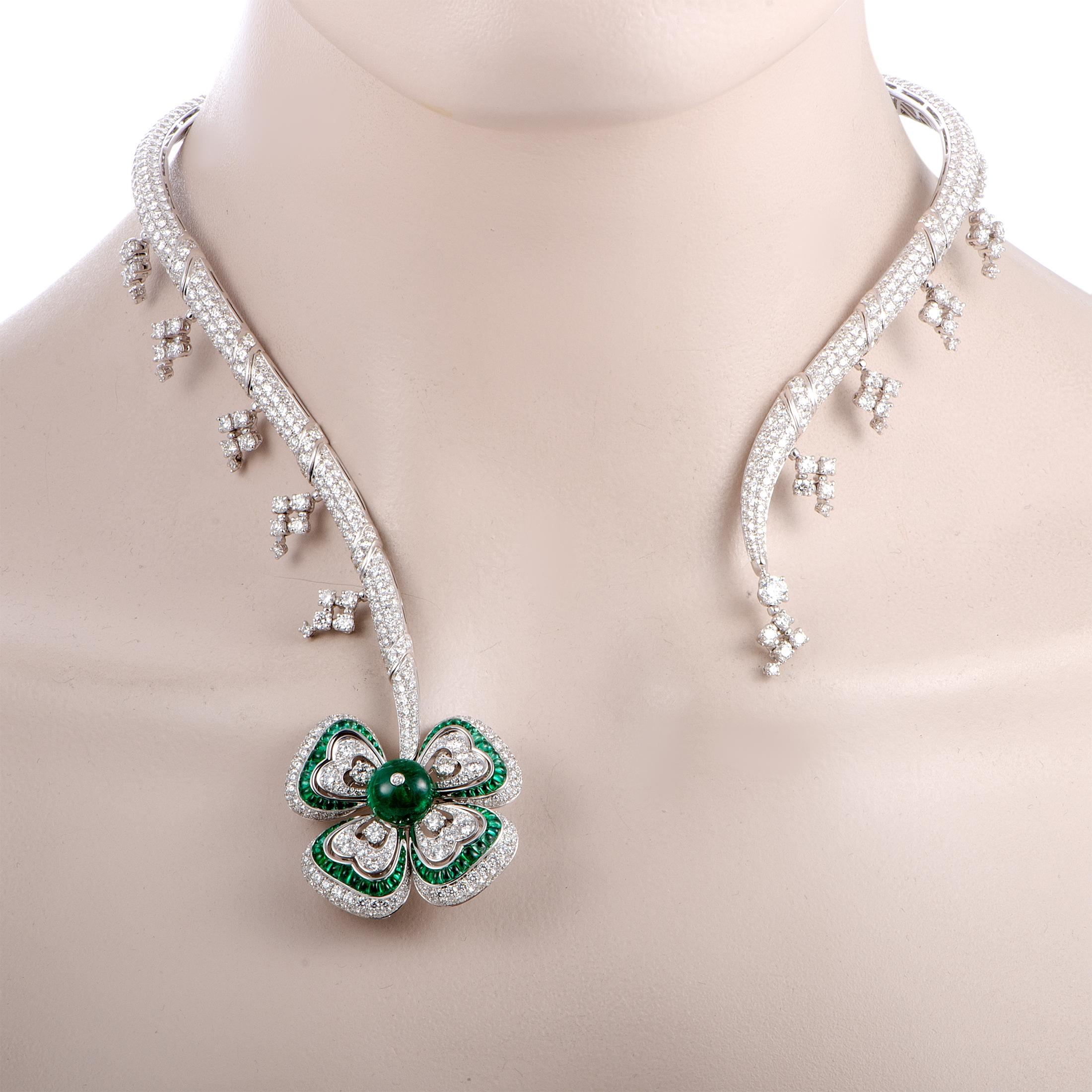 This Bvlgari necklace is crafted from 18K white gold and weighs 100 grams. It is set with emeralds and a total of 28.32 carats of diamonds that feature grade E color and VVS clarity. The center emerald stone weighs 2.36 carats and the remaining ones
