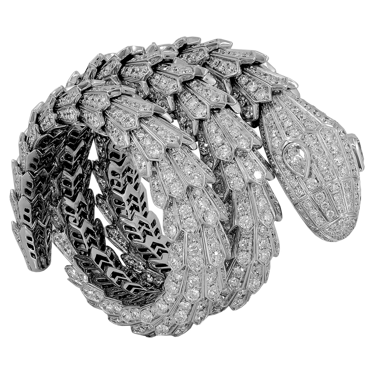 A magnificent 18k white gold Serpenti bracelet that captures the power and essence of seduction through the iconic Bulgari serpent, which sensually coils around the wrist exposing its pavé round brilliant cut diamond scales weighing approximately
